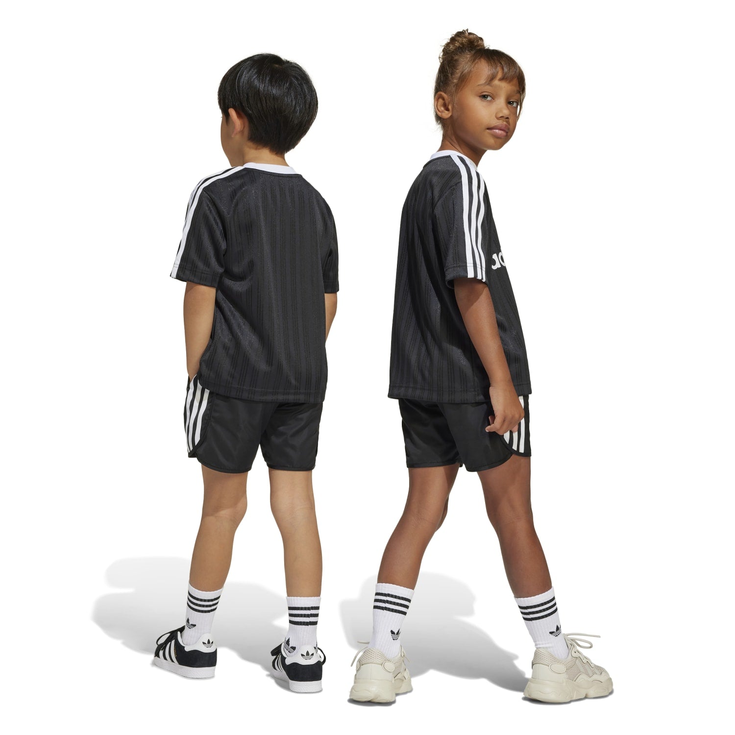 Children playing soccer outside with a compact, top-rated small soccer goal for backyard kids.