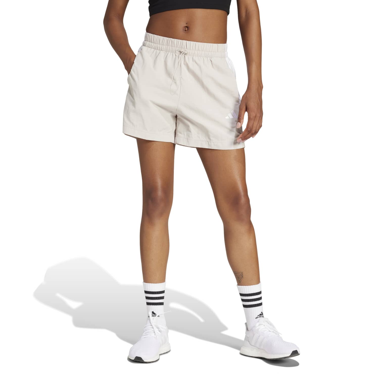 Side view of womens shorts with high waist worn during a sunny outdoor workout.