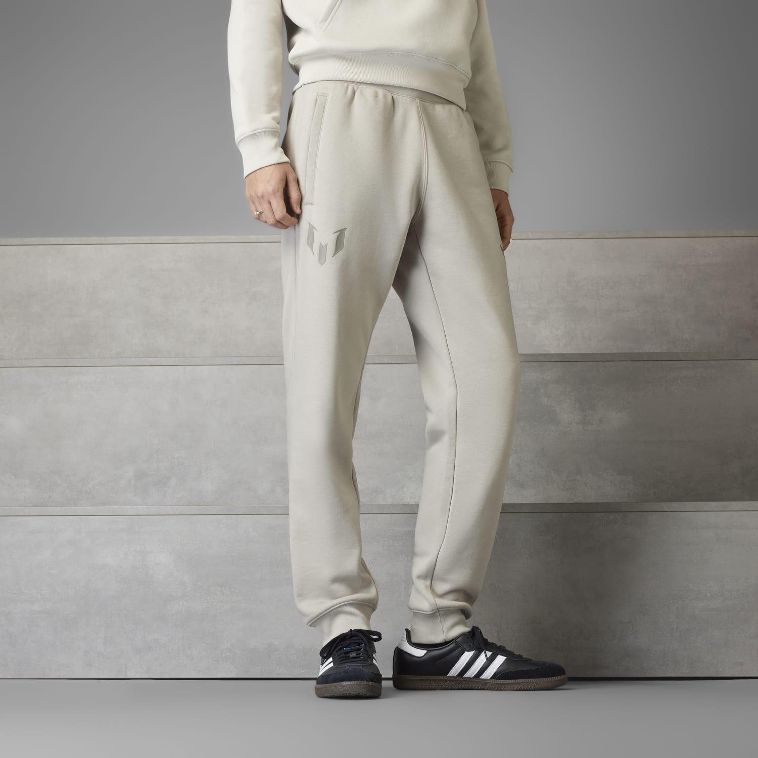 Mens fleece joggers with drawstring and pockets displayed outdoors