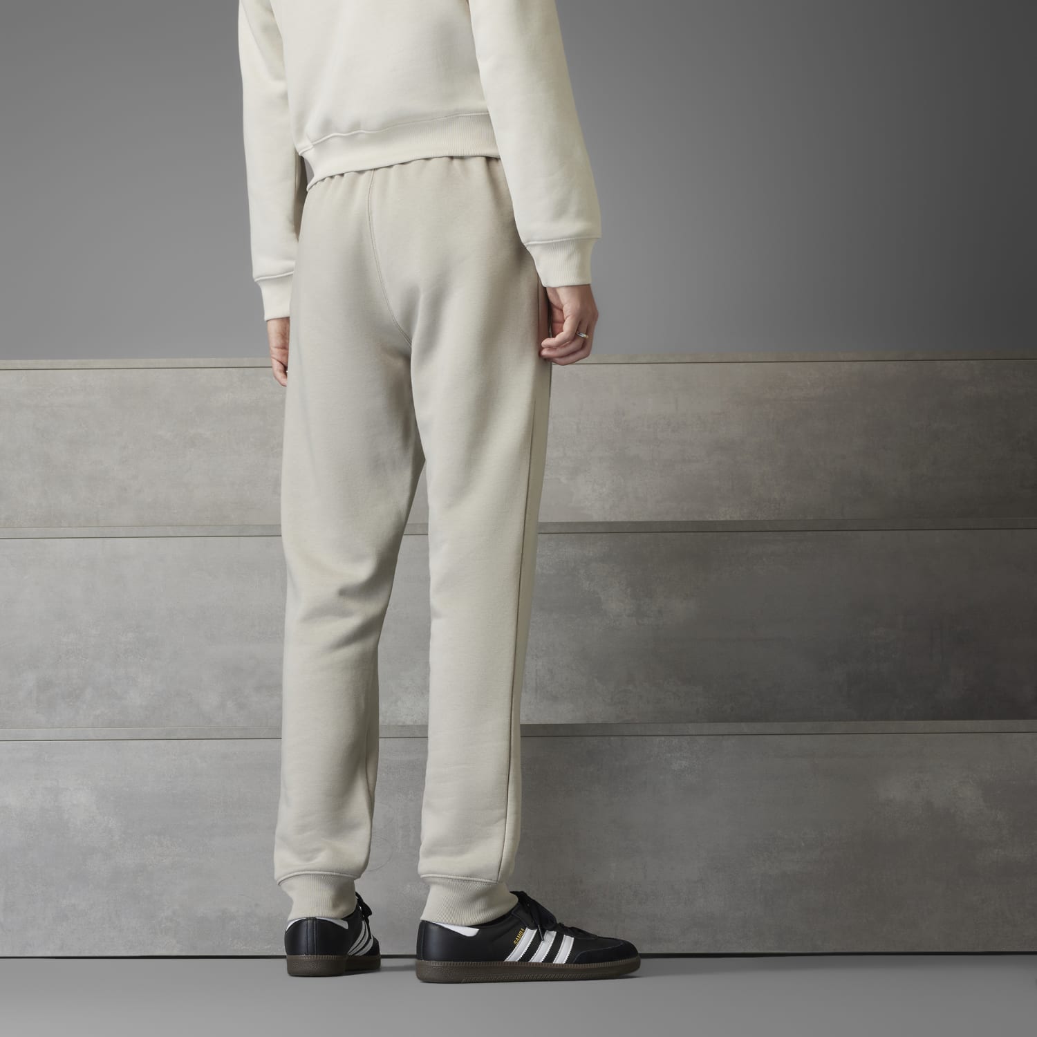Mens fleece joggers with drawstring and pockets displayed outdoors