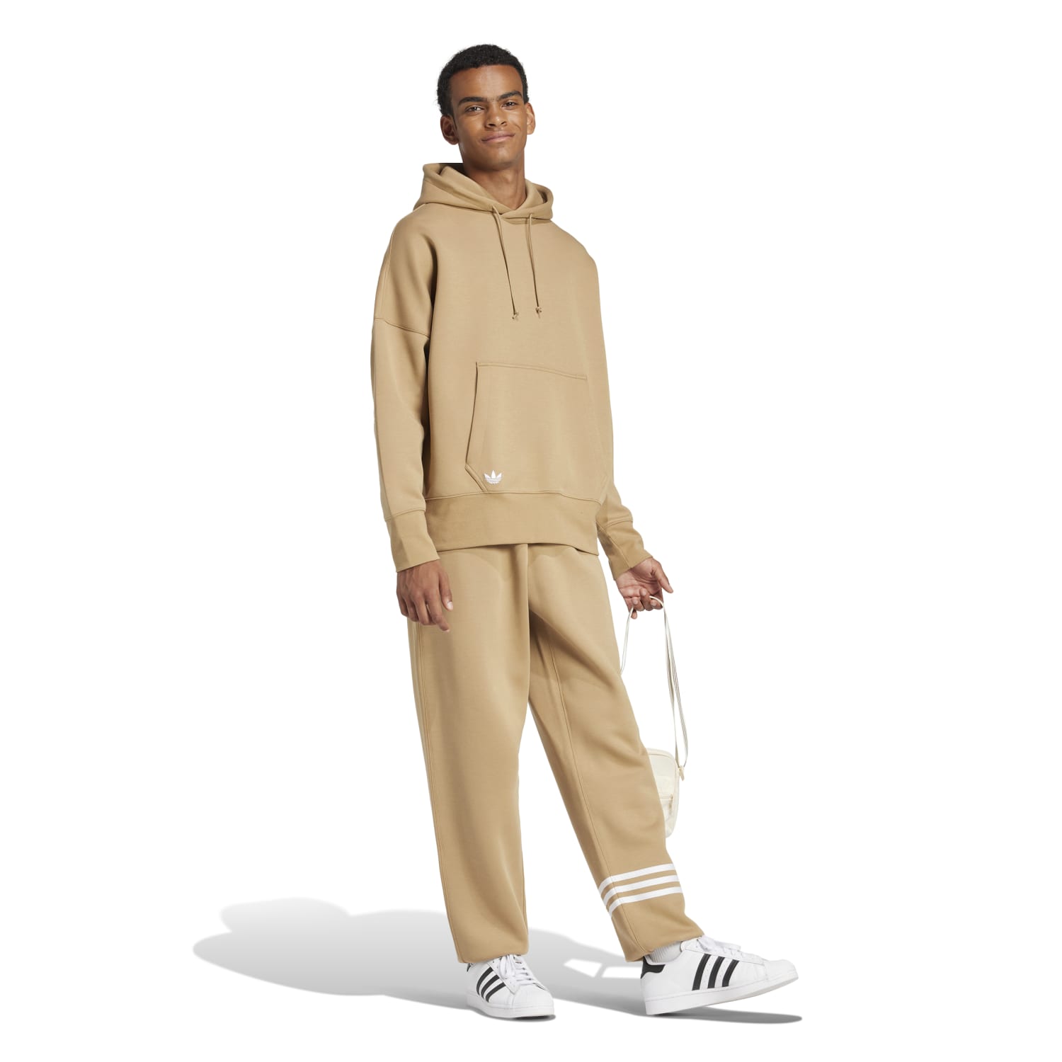 Model demonstrating the comfort of Adidas Neu Classics Mens Joggers during a casual outing.