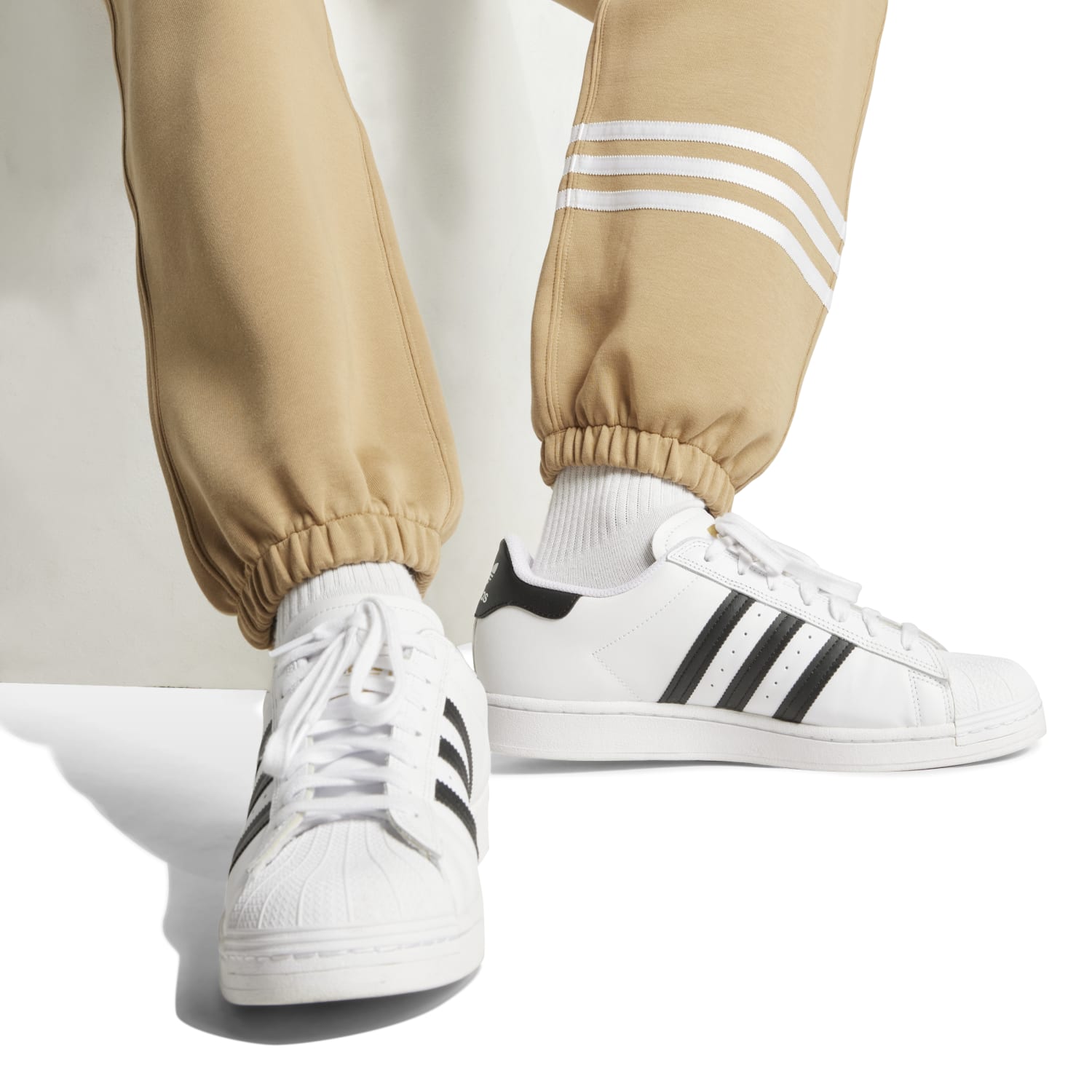 Close-up of the Adidas trefoil logo on the Neu Classics Mens Joggers.