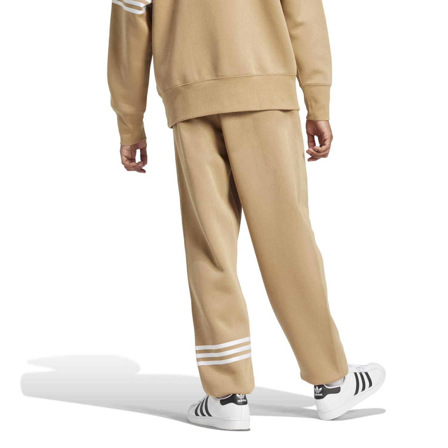 Model demonstrating the comfort of Adidas Neu Classics Mens Joggers during a casual outing.