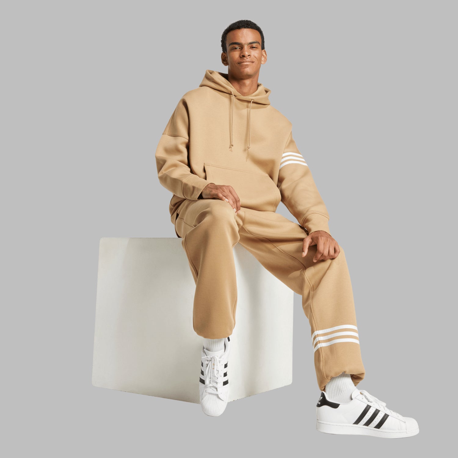 Model wearing the mens pullover hoodie in an urban setting