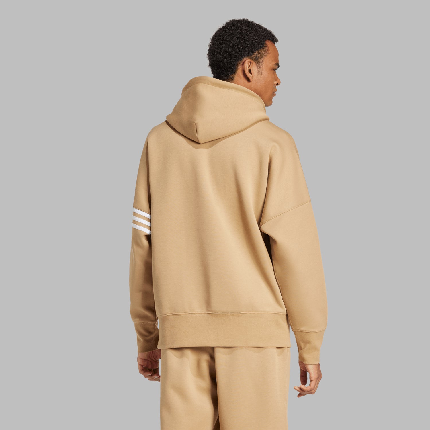 Model wearing the mens pullover hoodie in an urban setting