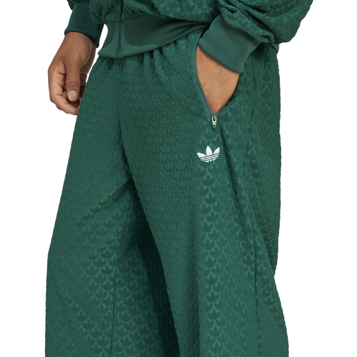 Front view of Adidas Classic Monogram Mens Track Pants showcasing the breathable fabric and relaxed fit.
