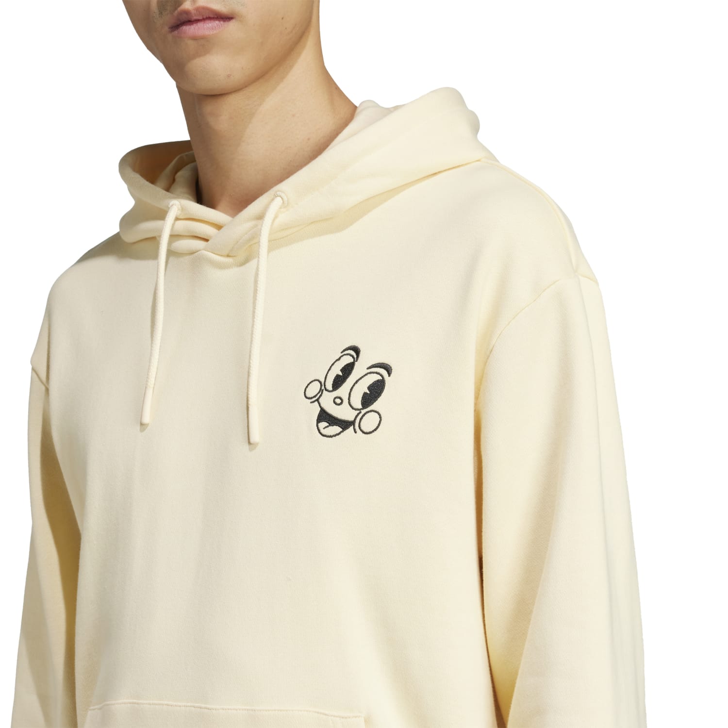 Front view of mens Adidas Made by Nelson PO hoodie in heather grey, displayed on a model at street level