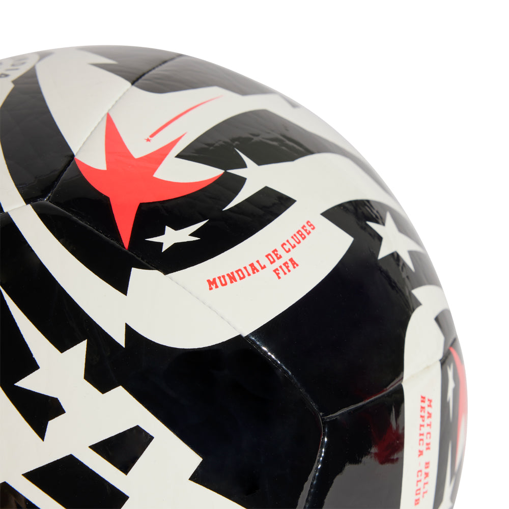 Player mid-volley with 2025 FIFA Club World Cup ball, showing controlled flight against a night sky