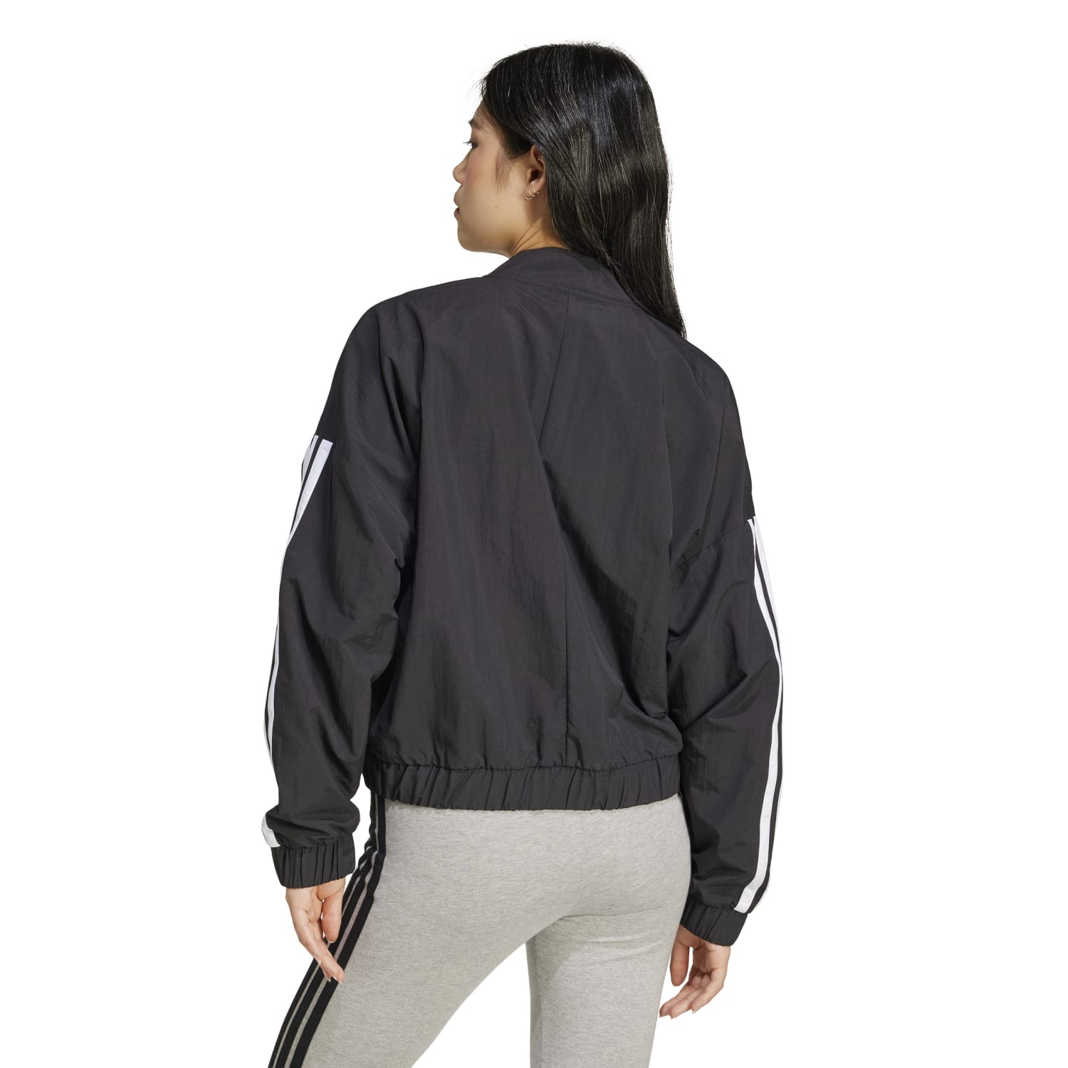 Front view of eco-friendly womens recycled bomber jacket showing the adidas three-stripe logo