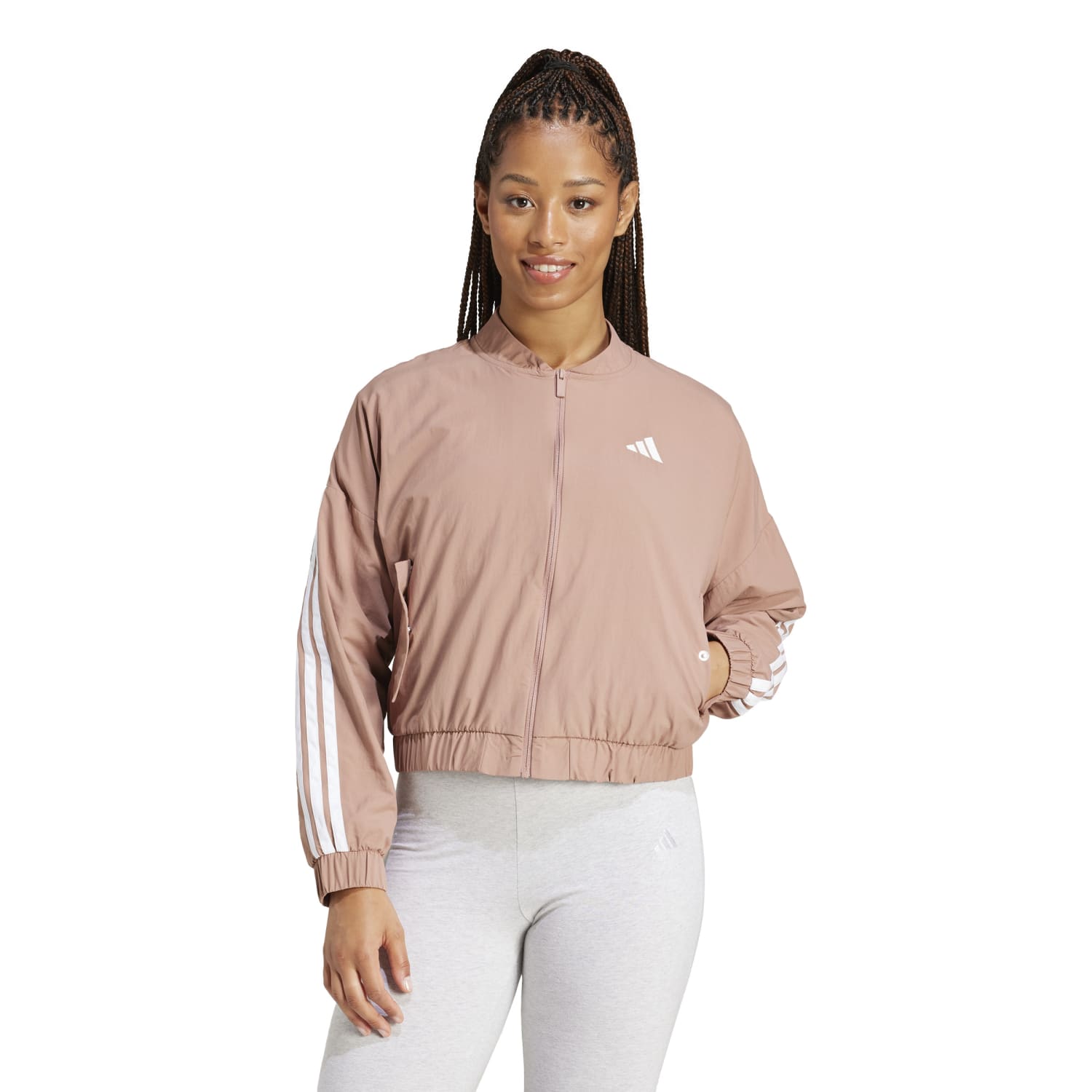Lightweight windbreaker for women, featuring the adidas three-stripe logo, perfect for casual wear.