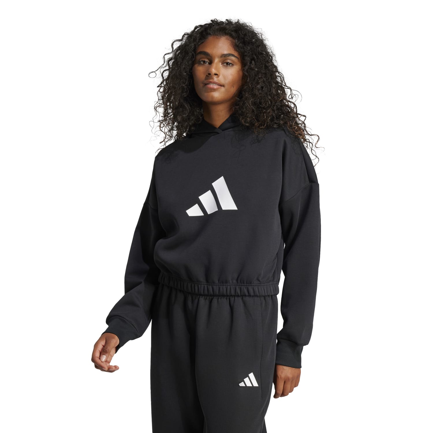 Close-up of the hoodie’s iconic three-stripe design on sleeve