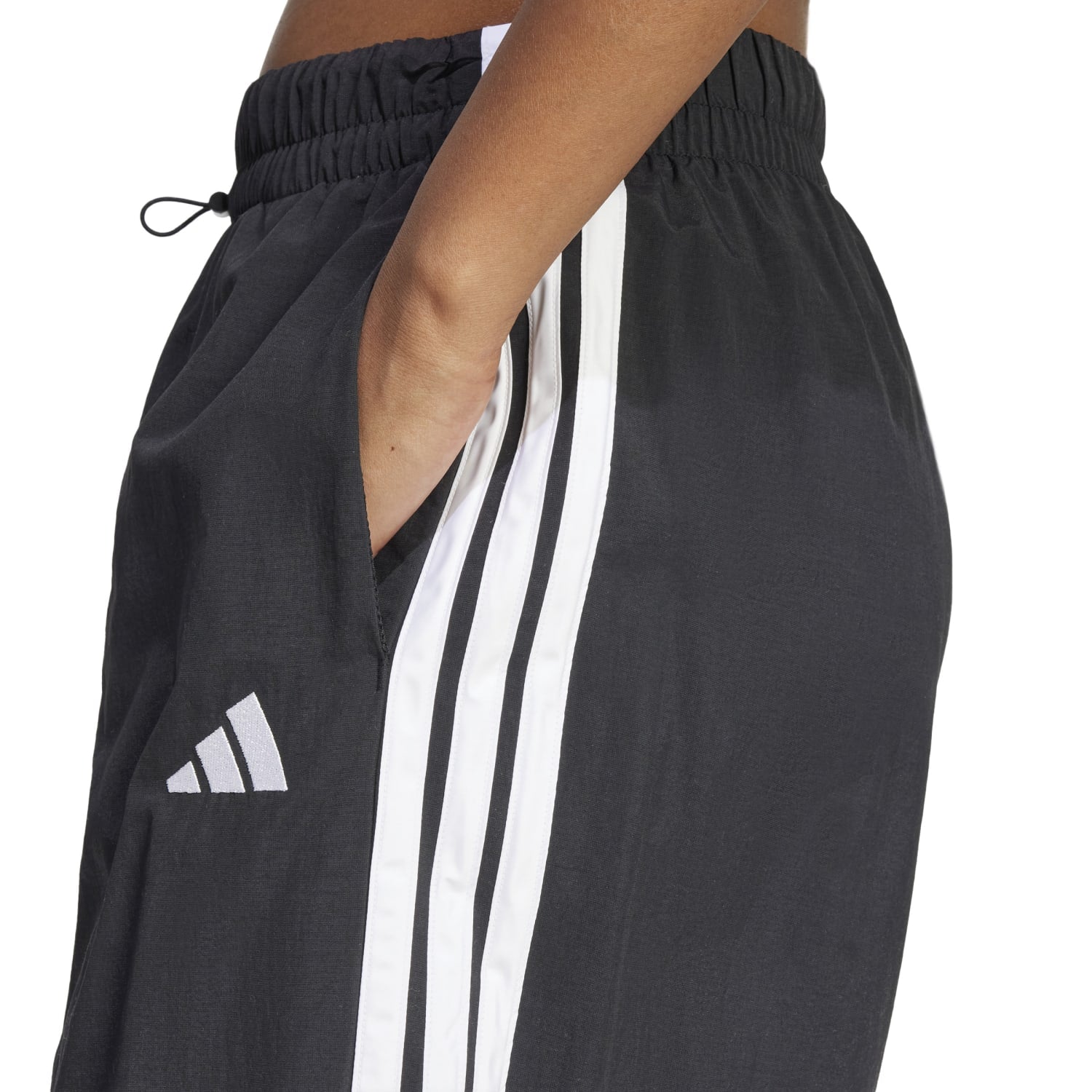 Side view of eco-friendly Adidas pants, highlighting the bungee closure.