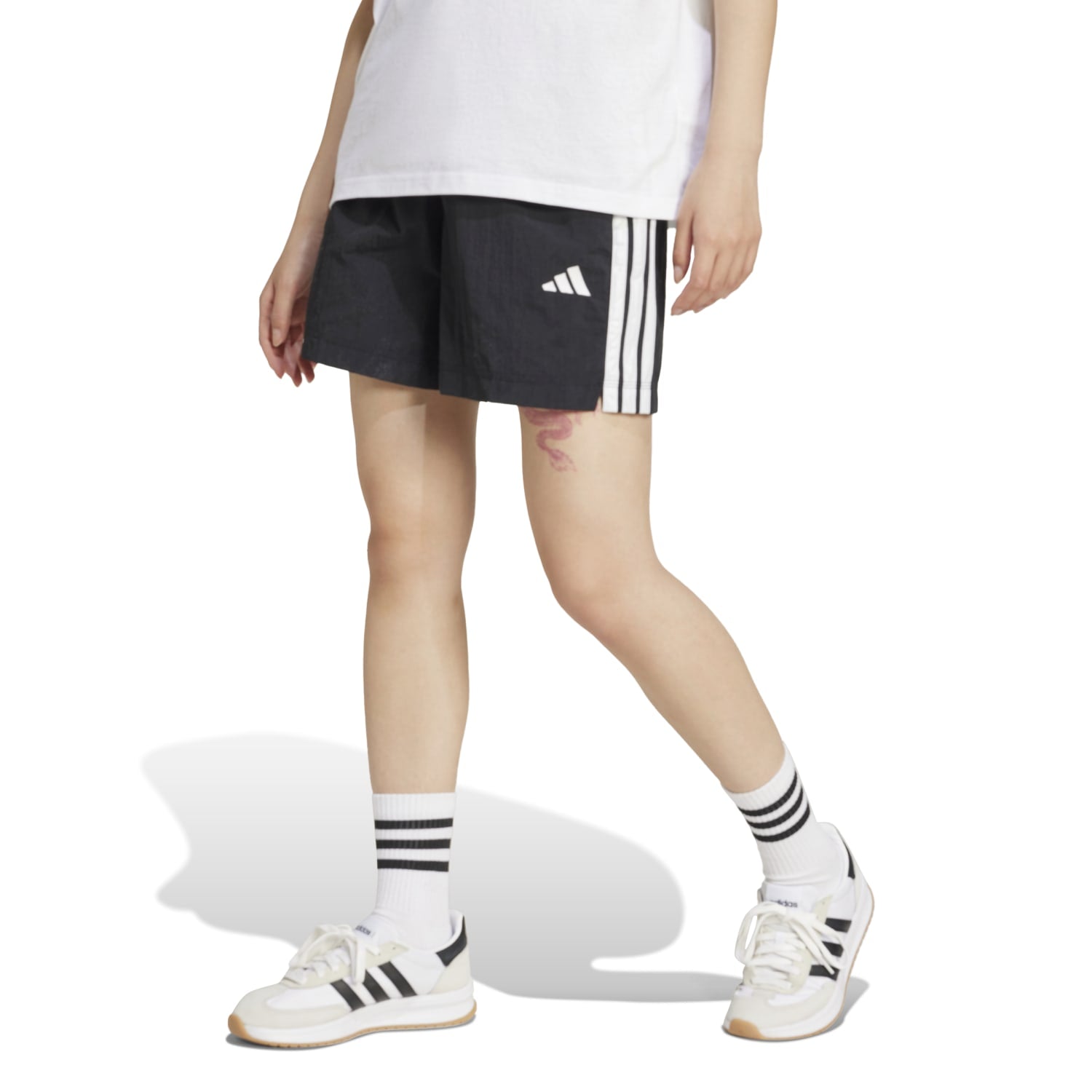 Side view of the Adidas Womens shorts, emphasizing the high-rise cut and pocket details.