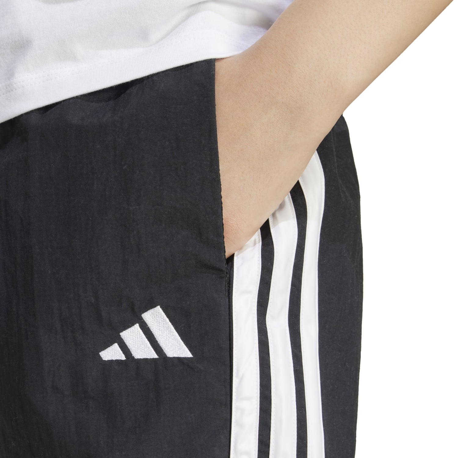 Front view of Adidas Womens High-Rise 3-Stripe Athletic Shorts, showcasing the breathable fabric and stylish design.
