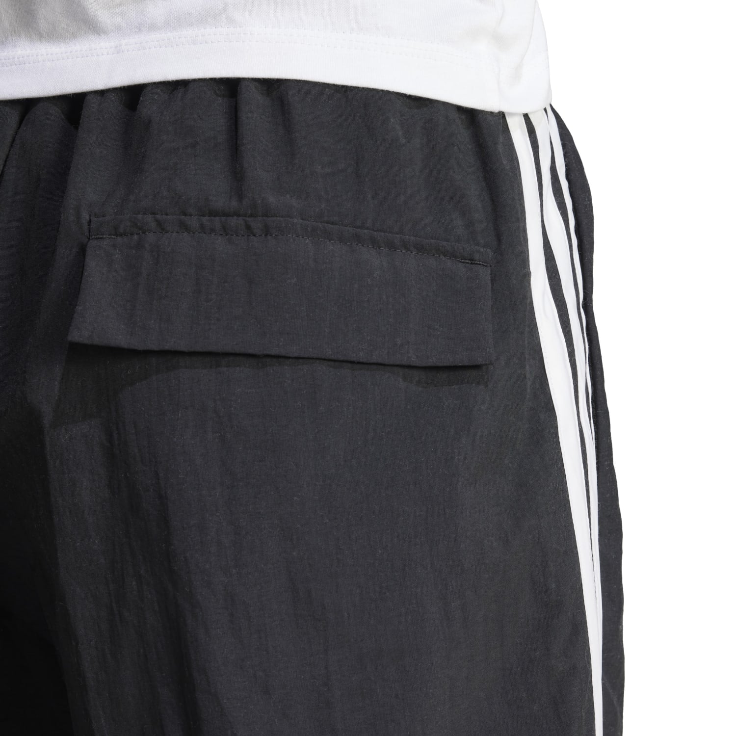Side view of the Adidas Womens shorts, emphasizing the high-rise cut and pocket details.