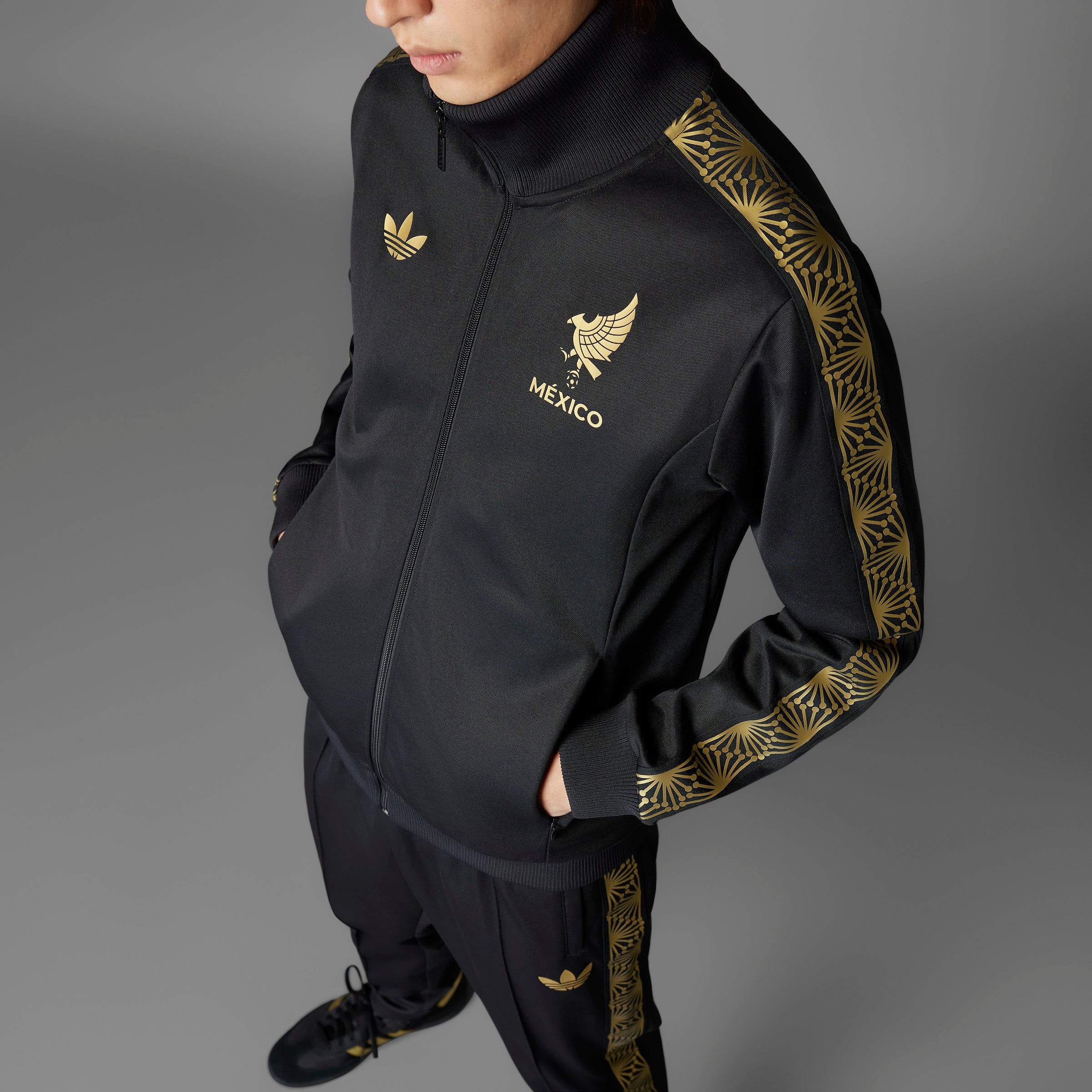 Side view of the Adidas Mexico Track Top highlighting the ribbed collar and cuffs.