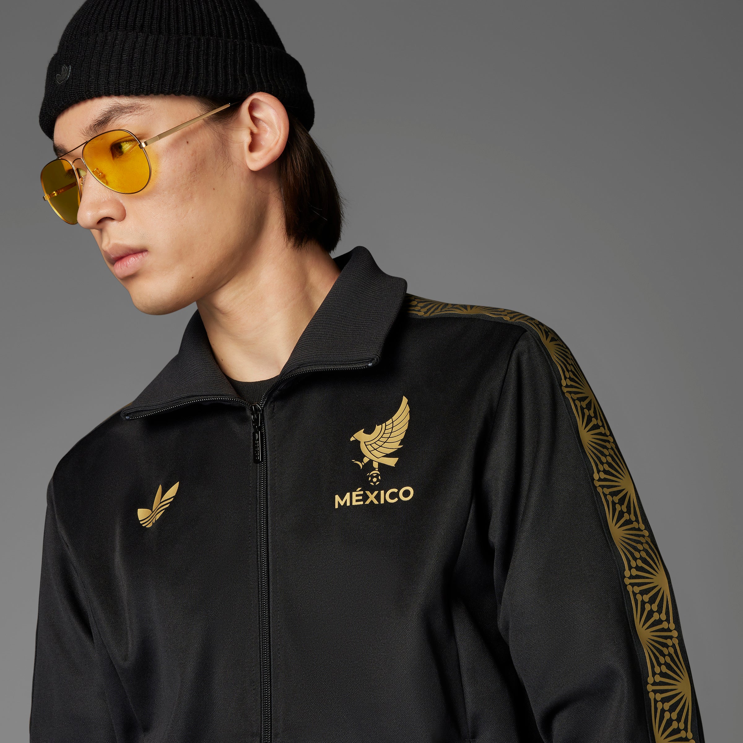 Side view of the Adidas Mexico Track Top highlighting the ribbed collar and cuffs.
