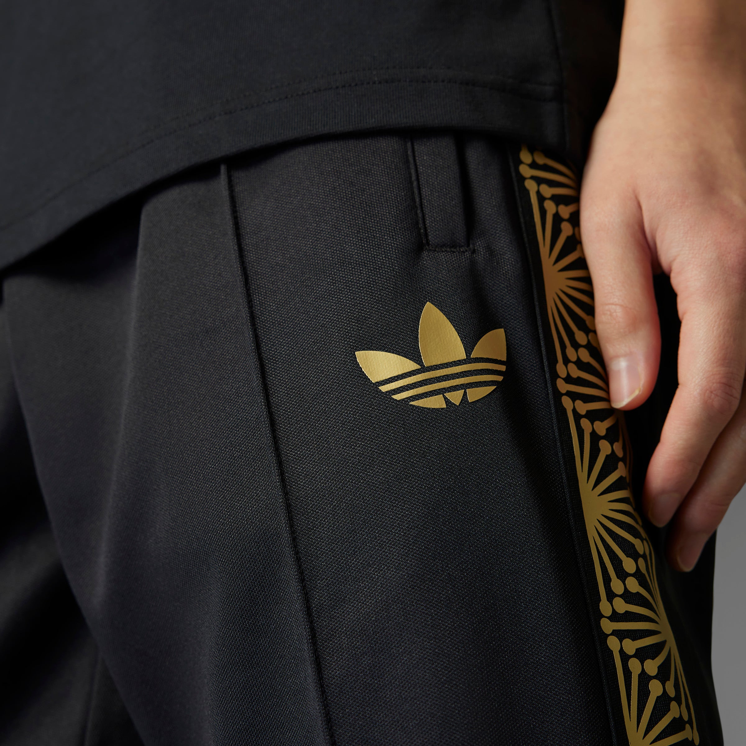 Adidas Mexico pants displayed with front pockets, perfect for casual wear or cheering on your team.