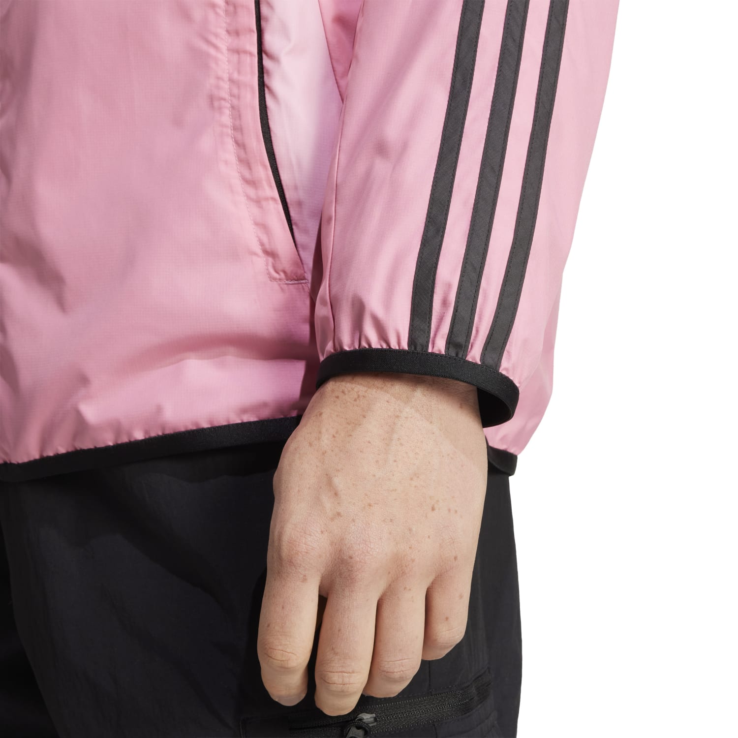 Lifestyle photo of stylish pink jacket for men worn casually outdoors