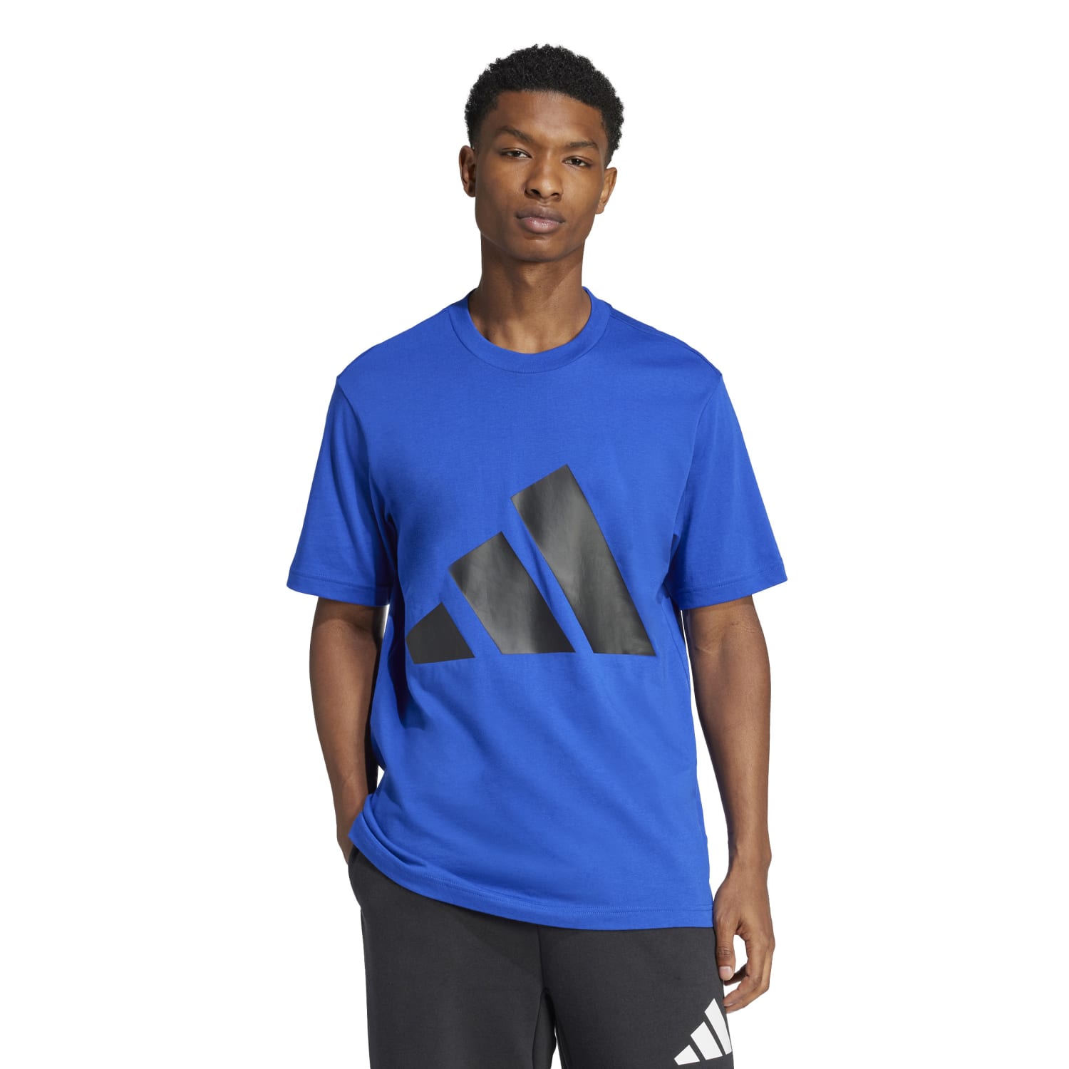Model wearing Adidas mens athletic t-shirt during a workout session, showcasing its comfortable fit.