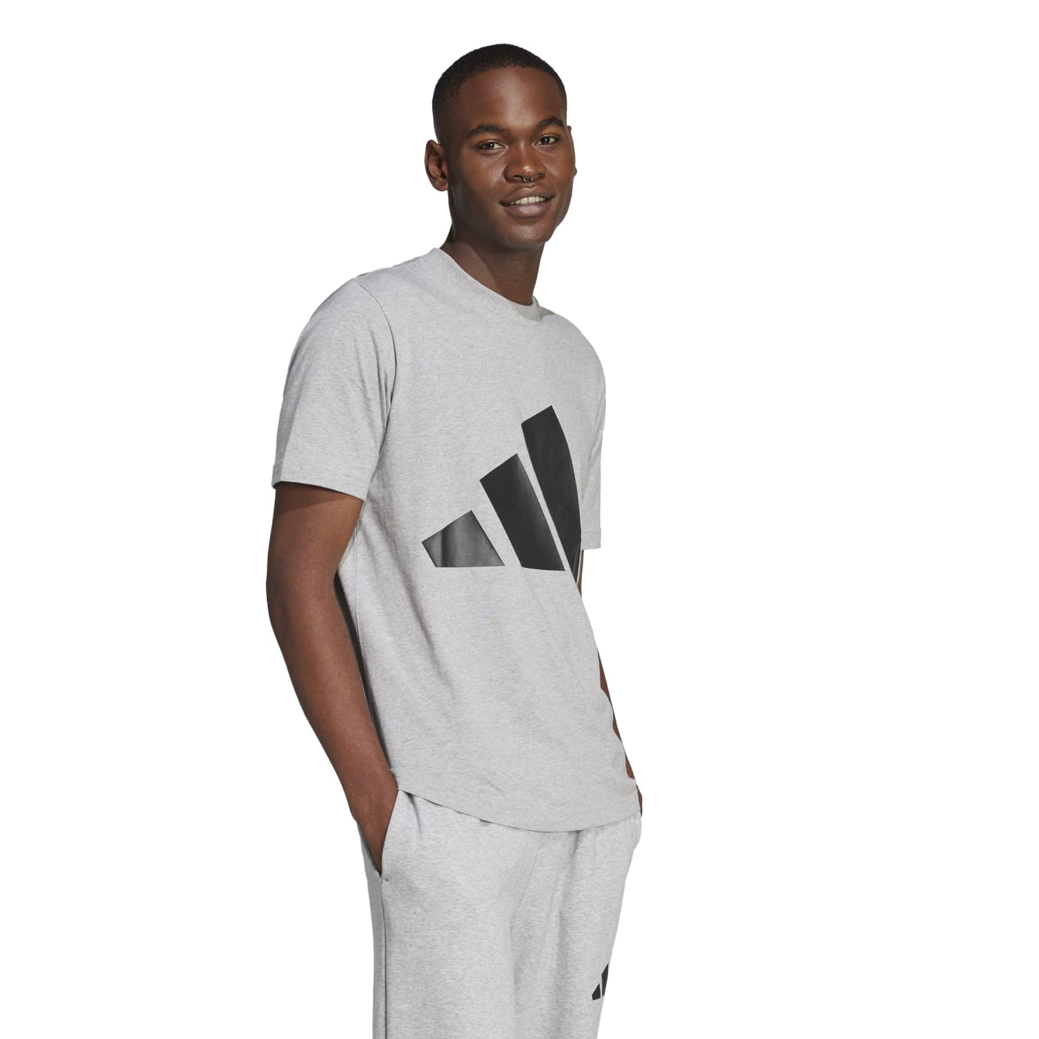Front view of athletic tee with adidas Badge of Sport displayed boldly