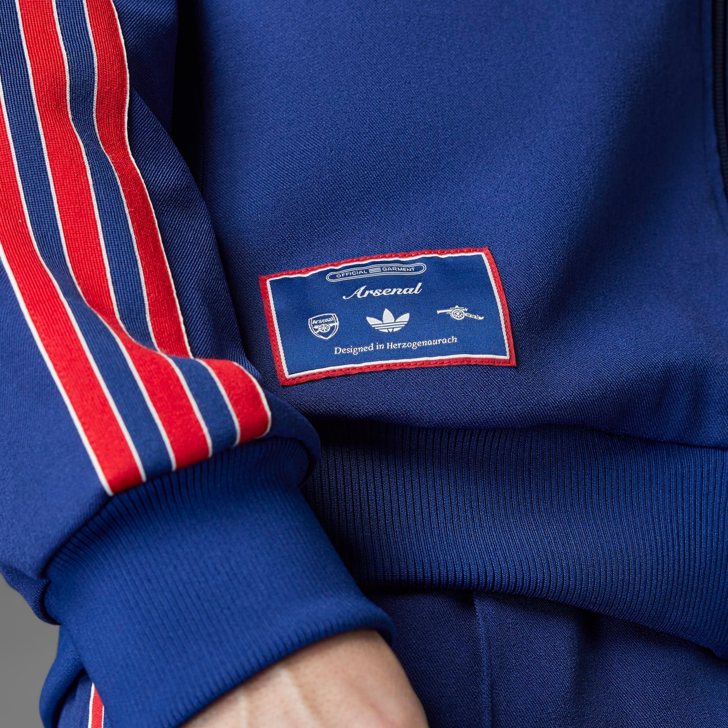 Front view highlighting the fitted cuffs and hem of the Arsenal jacket