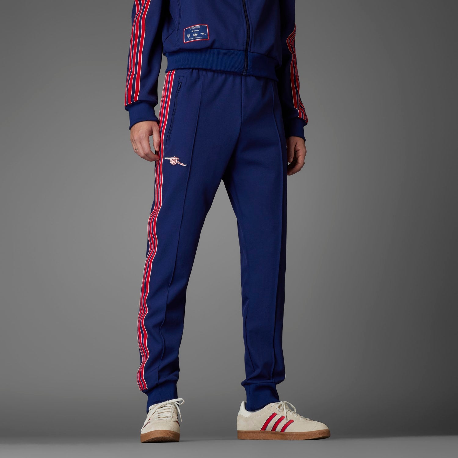 Side view of adidas Arsenal Icon Mens Track Pants with ribbed cuffs, perfect for casual outings.