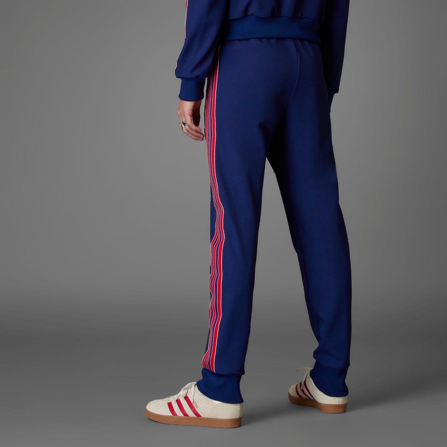 Front view of adidas Arsenal Icon Mens Track Pants highlighting the relaxed fit and drawstring waistband.
