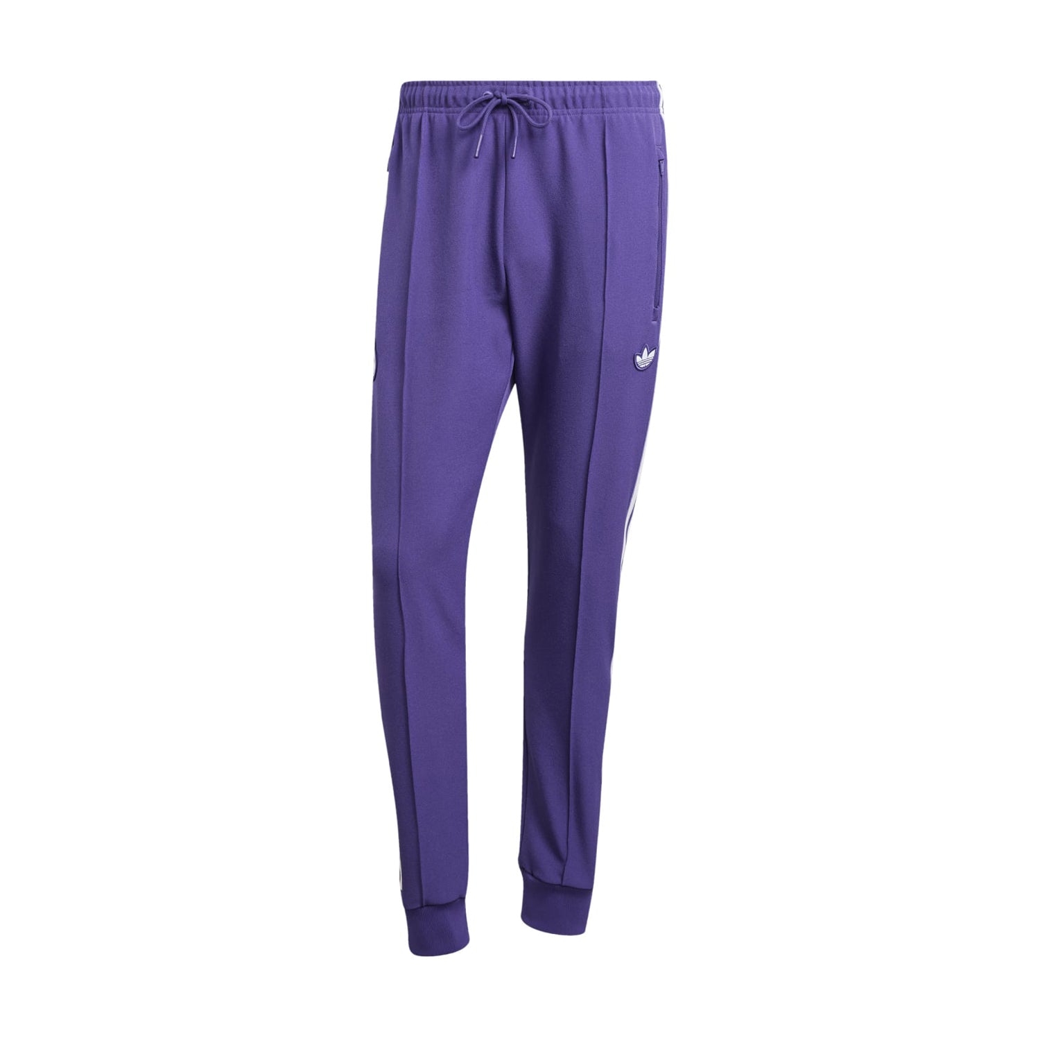 Close-up of Real Madrid track pants featuring sleek design and embroidered crest. Close-up of Real Madrid track pants featuring sleek design and embroidered crest.