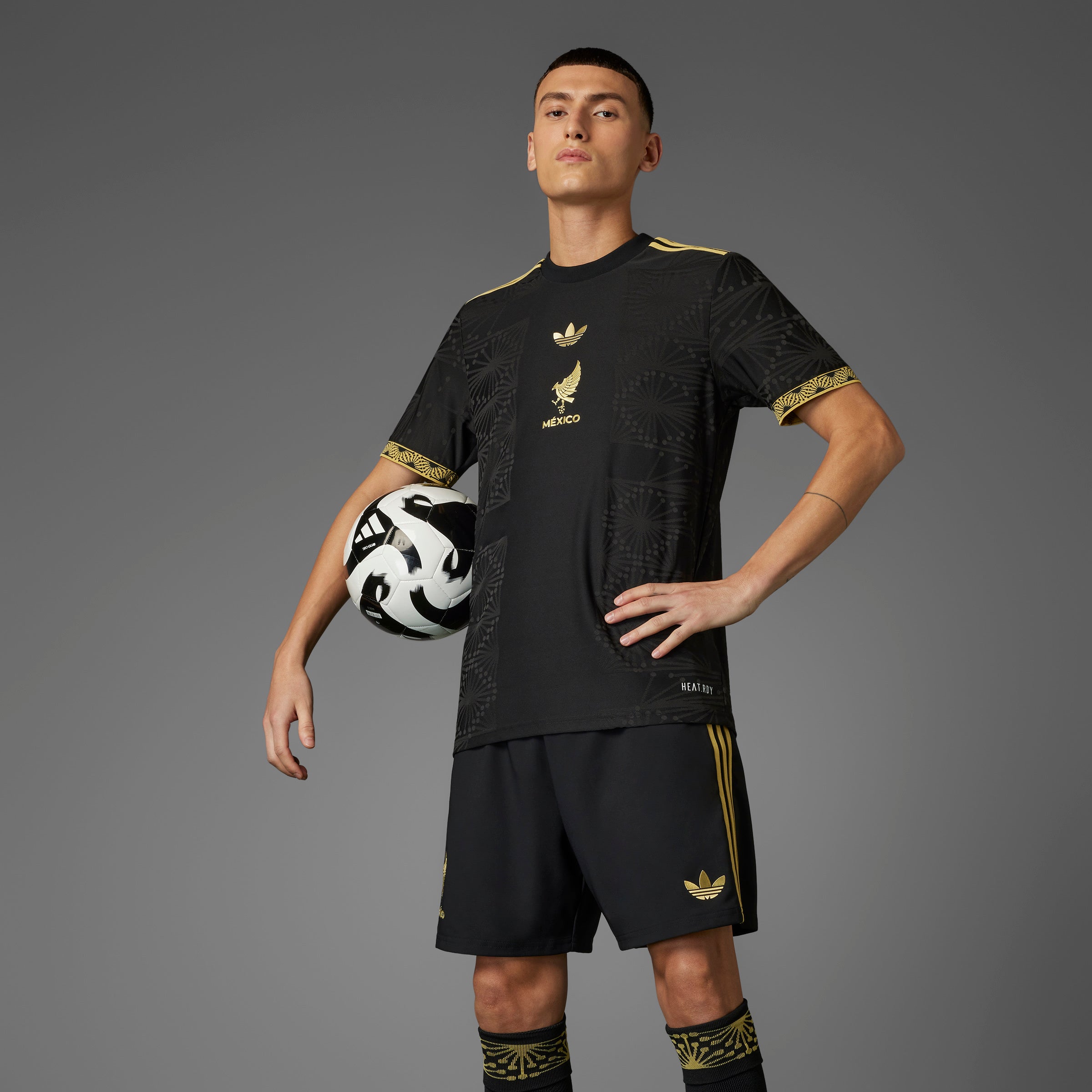 Side angle of the Mexico national team gold jersey, demonstrating the slim fit and crewneck design.
