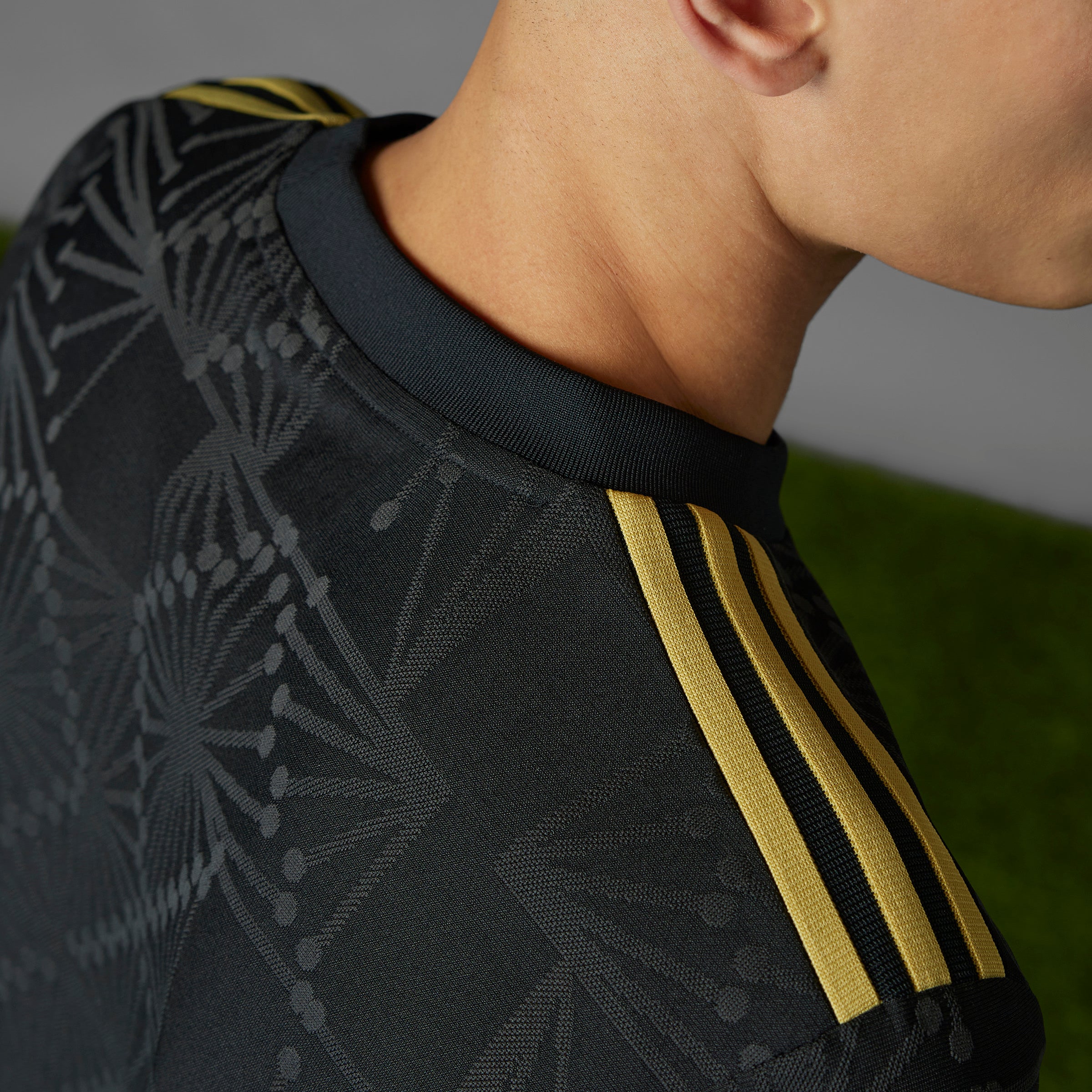 Side angle of the Mexico national team gold jersey, demonstrating the slim fit and crewneck design.
