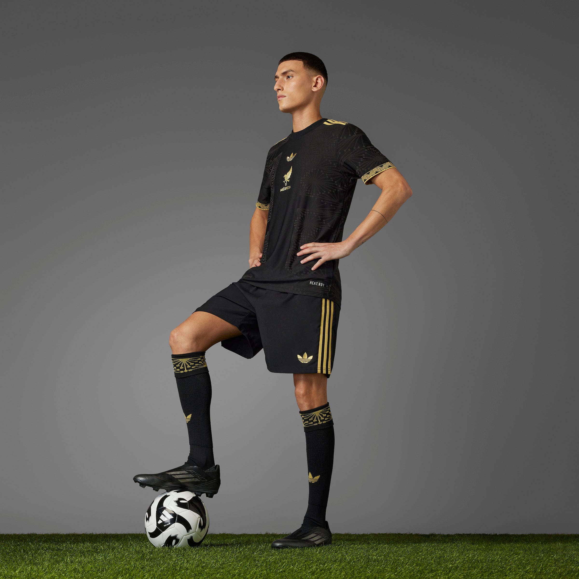 Front view of the Adidas Mexico Gold jersey for men, highlighting the gold details and team crest.