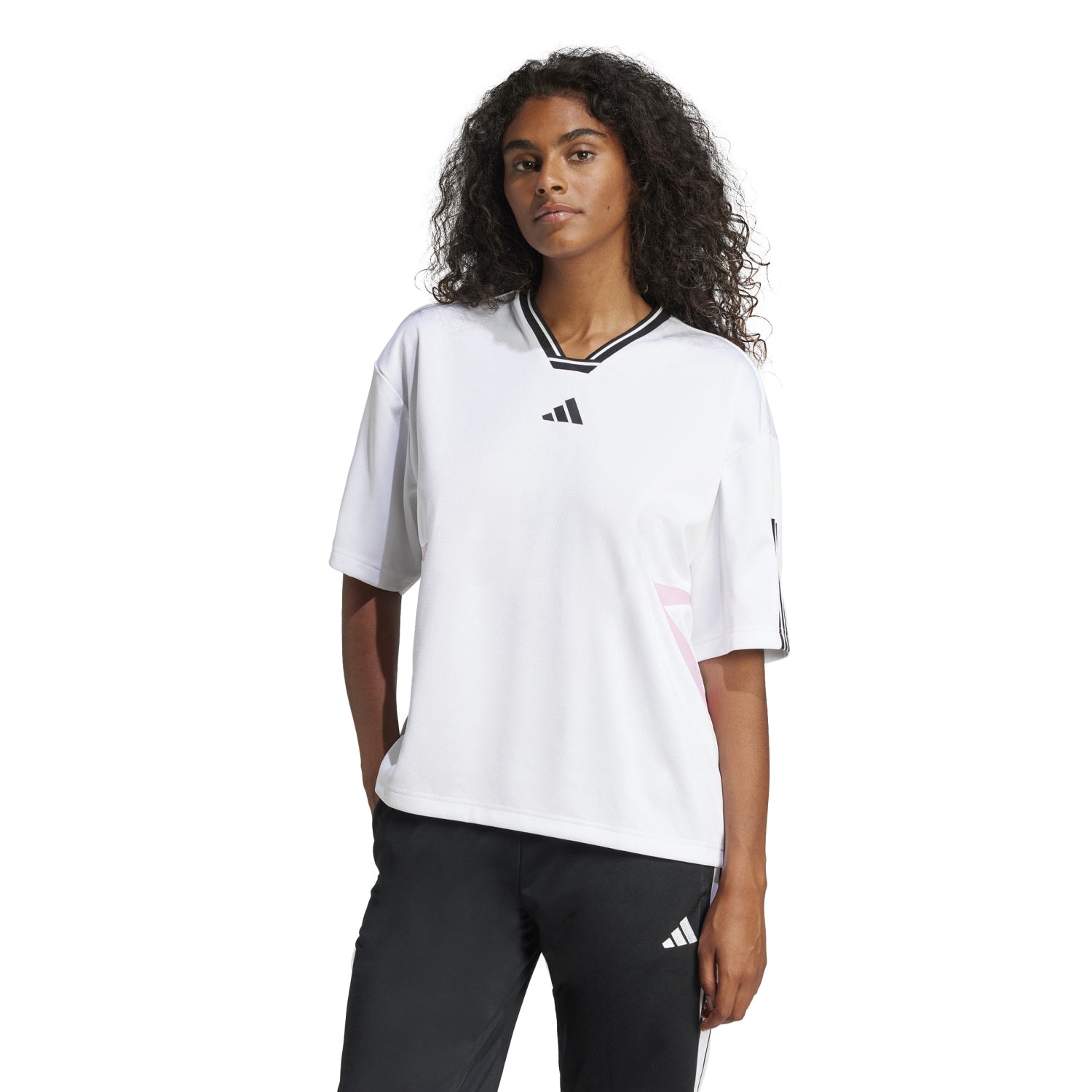 Model wearing the adidas oversized tee in a relaxed setting, highlighting comfort and style