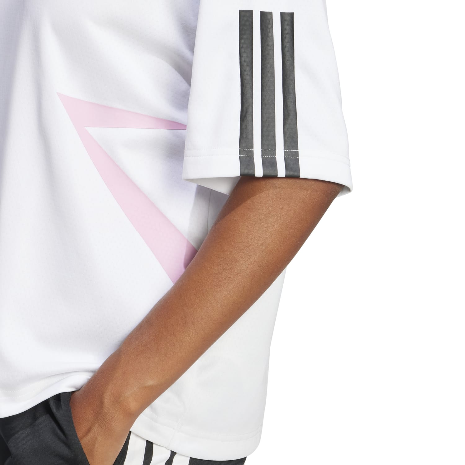 Model wearing the adidas oversized tee in a relaxed setting, highlighting comfort and style