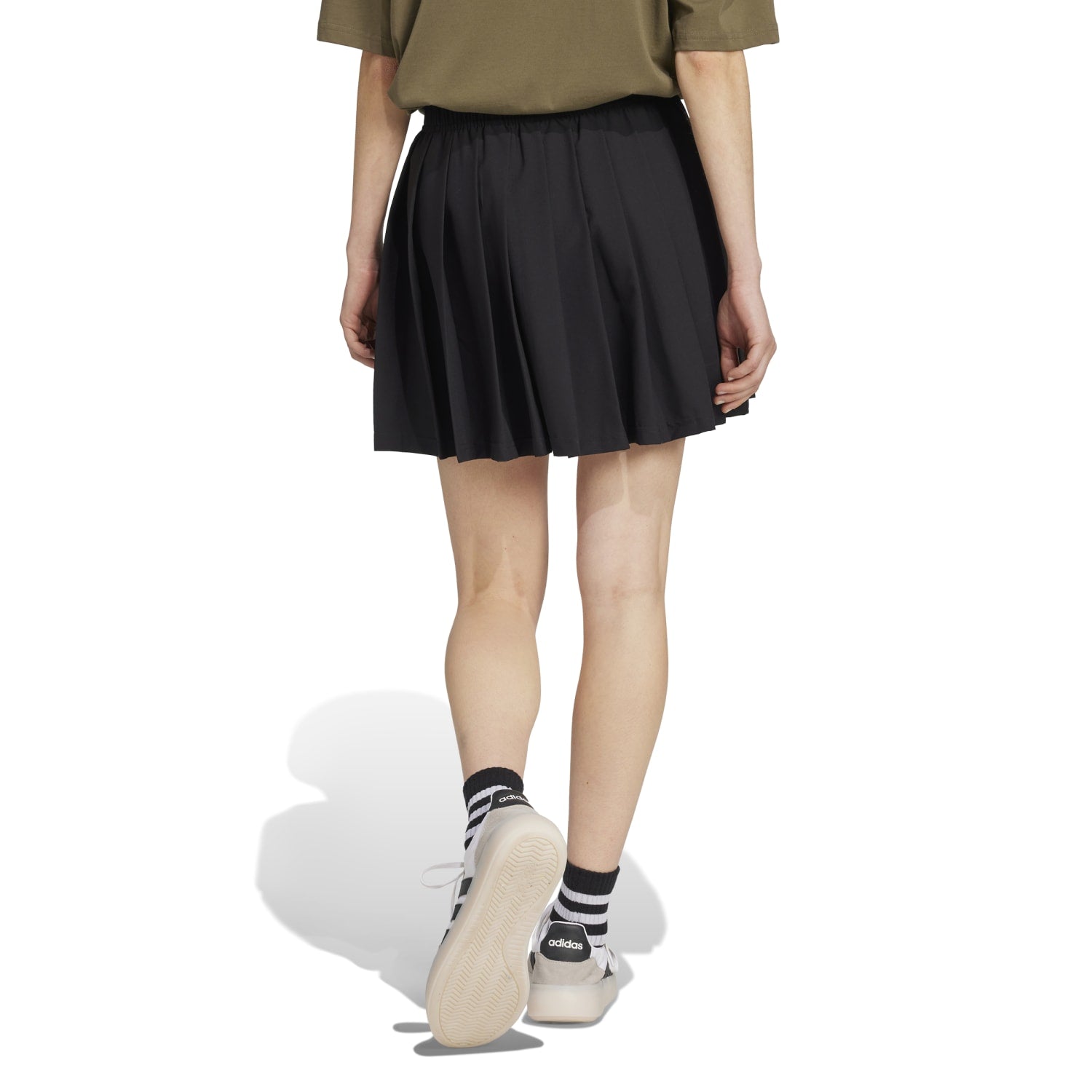 Chic Tiro Pleated Skirt for Women, styled with a casual top and sandals.