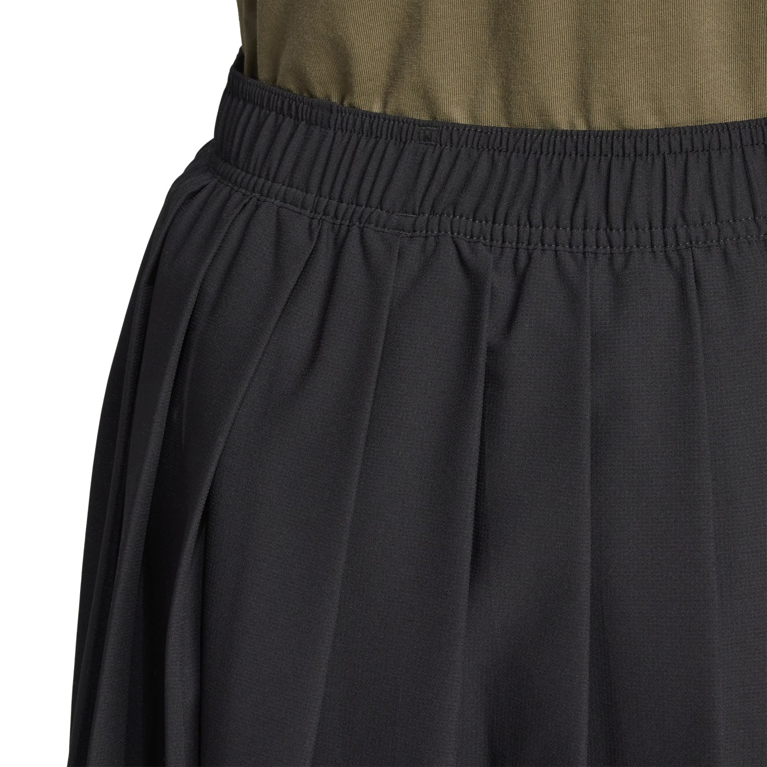 Close-up of the pleats on the Tiro Pleated Skirt, showcasing its elegant design.