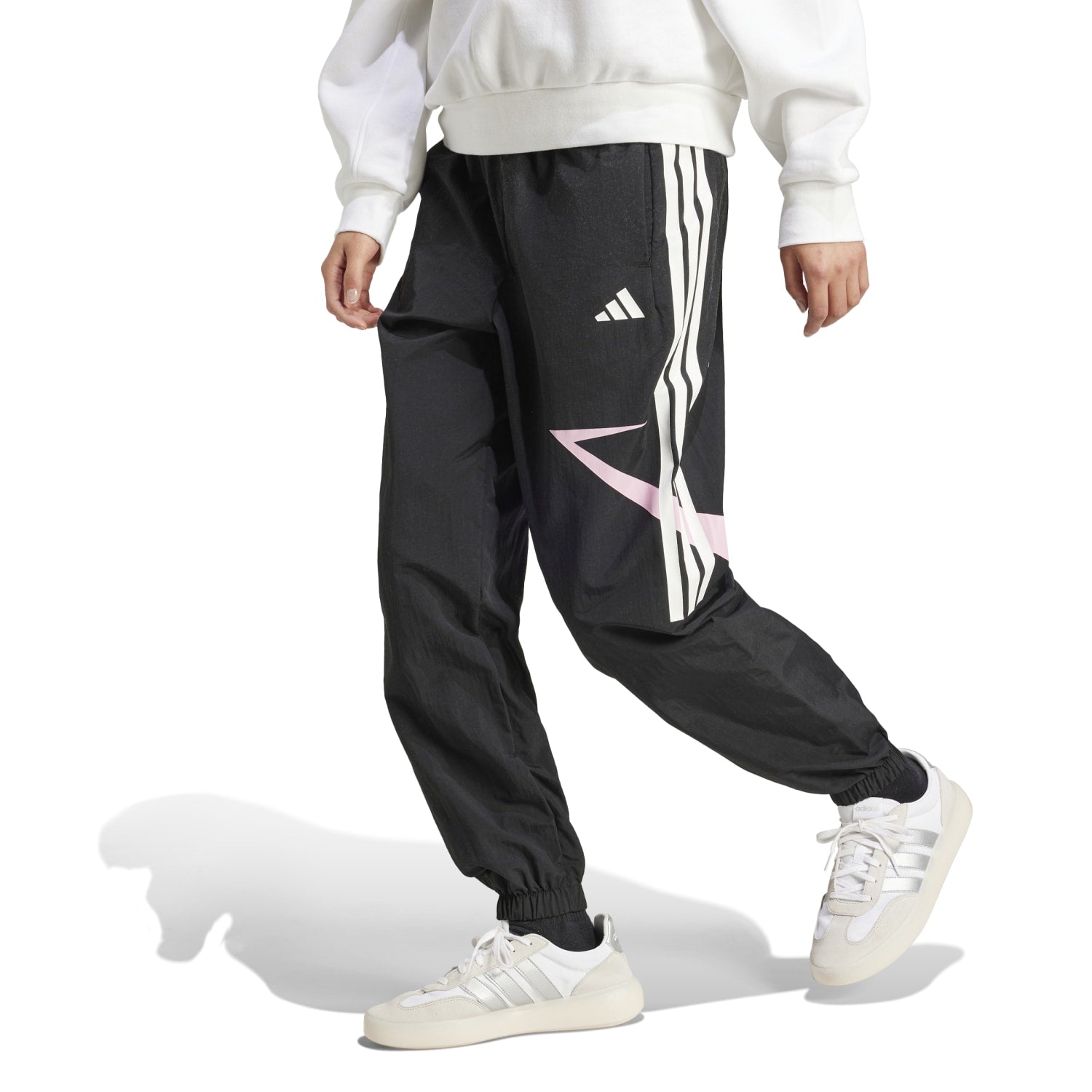 Close-up of the elastic waistband and side snap-button slits on Adidas womens workout pants