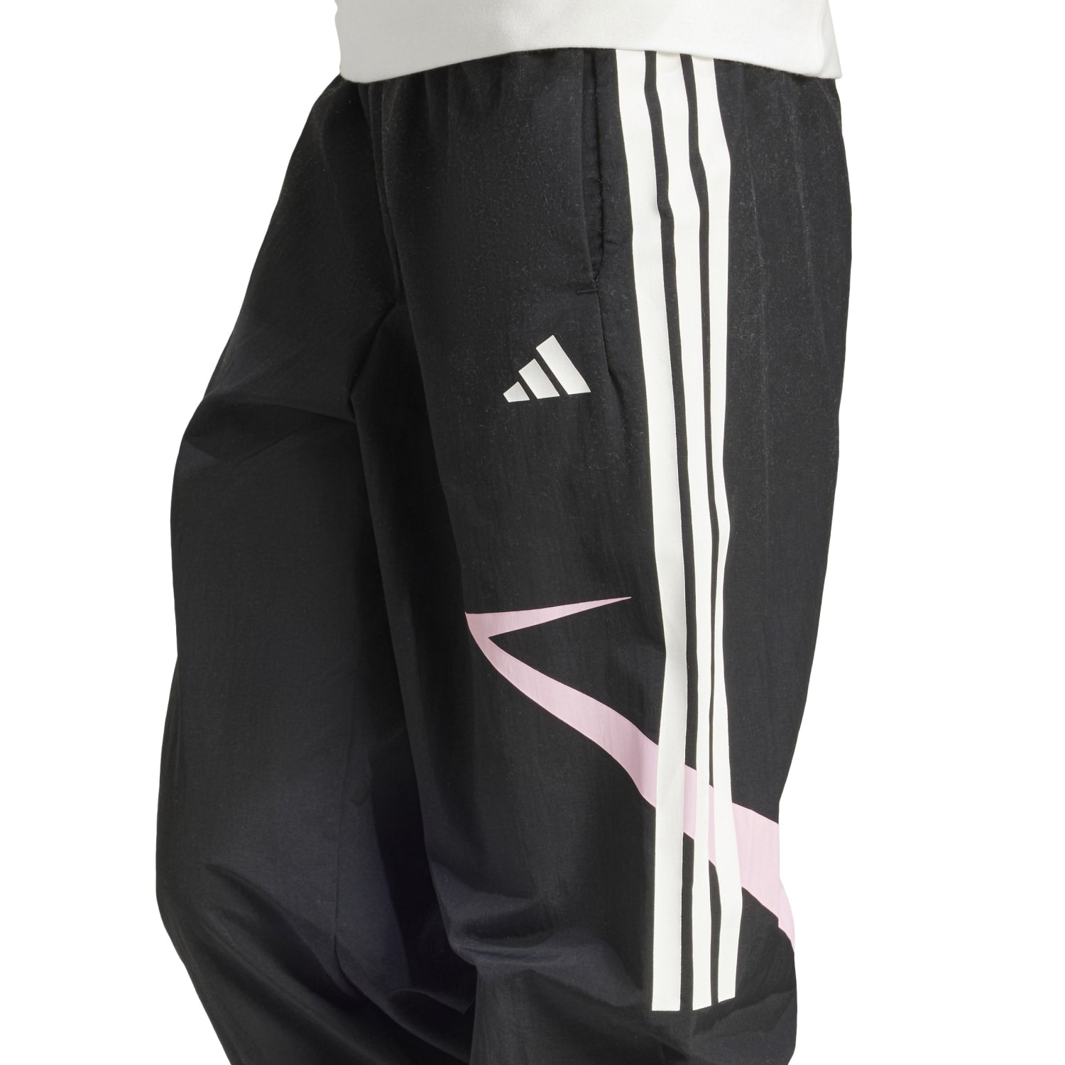 Close-up of the elastic waistband and side snap-button slits on Adidas womens workout pants