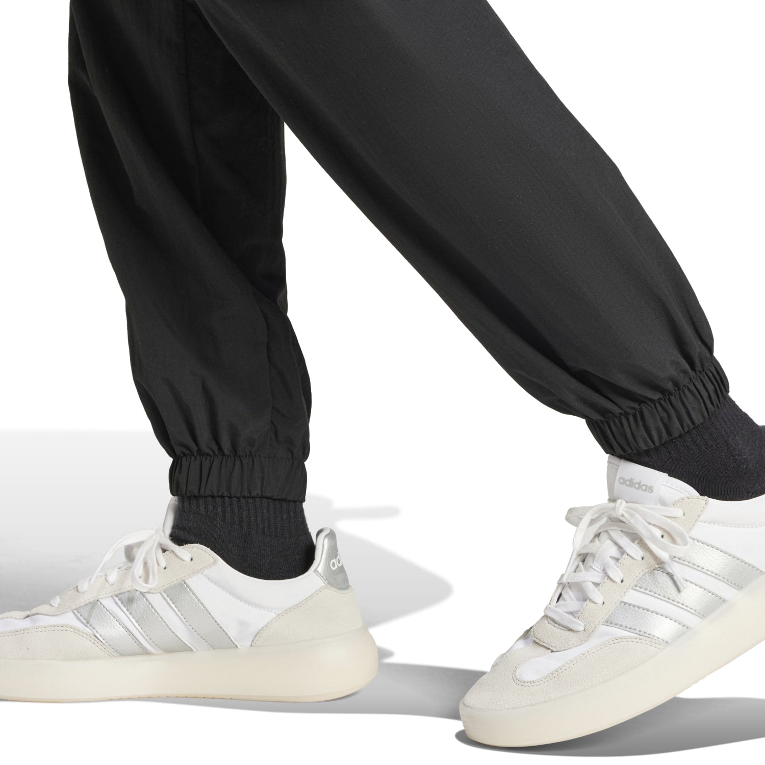 Woman wearing Adidas womens athletic pants with pockets during a workout session