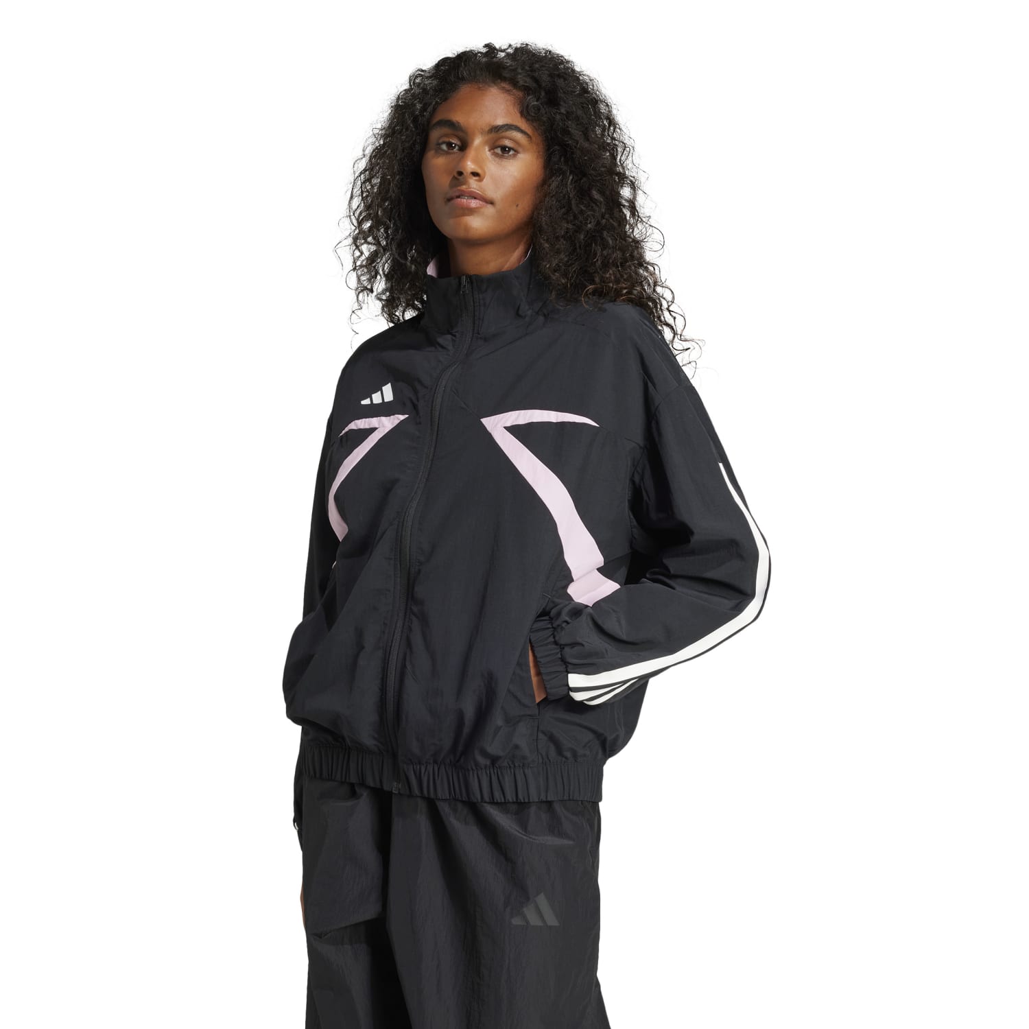 Close-up of the side pockets and silicone badge on the womens sports jacket