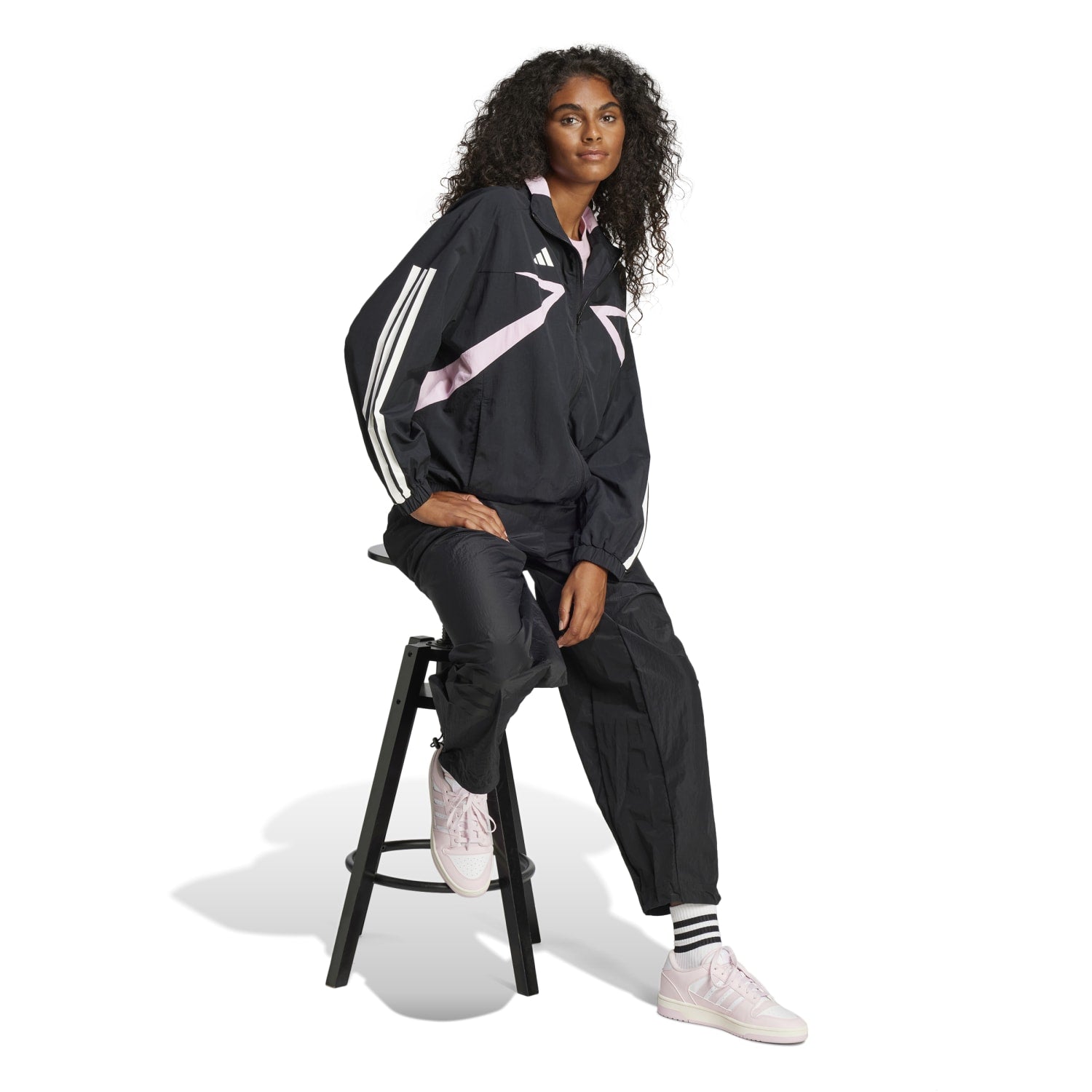 Model wearing the athletic zip-up jacket during a spring workout outdoors
