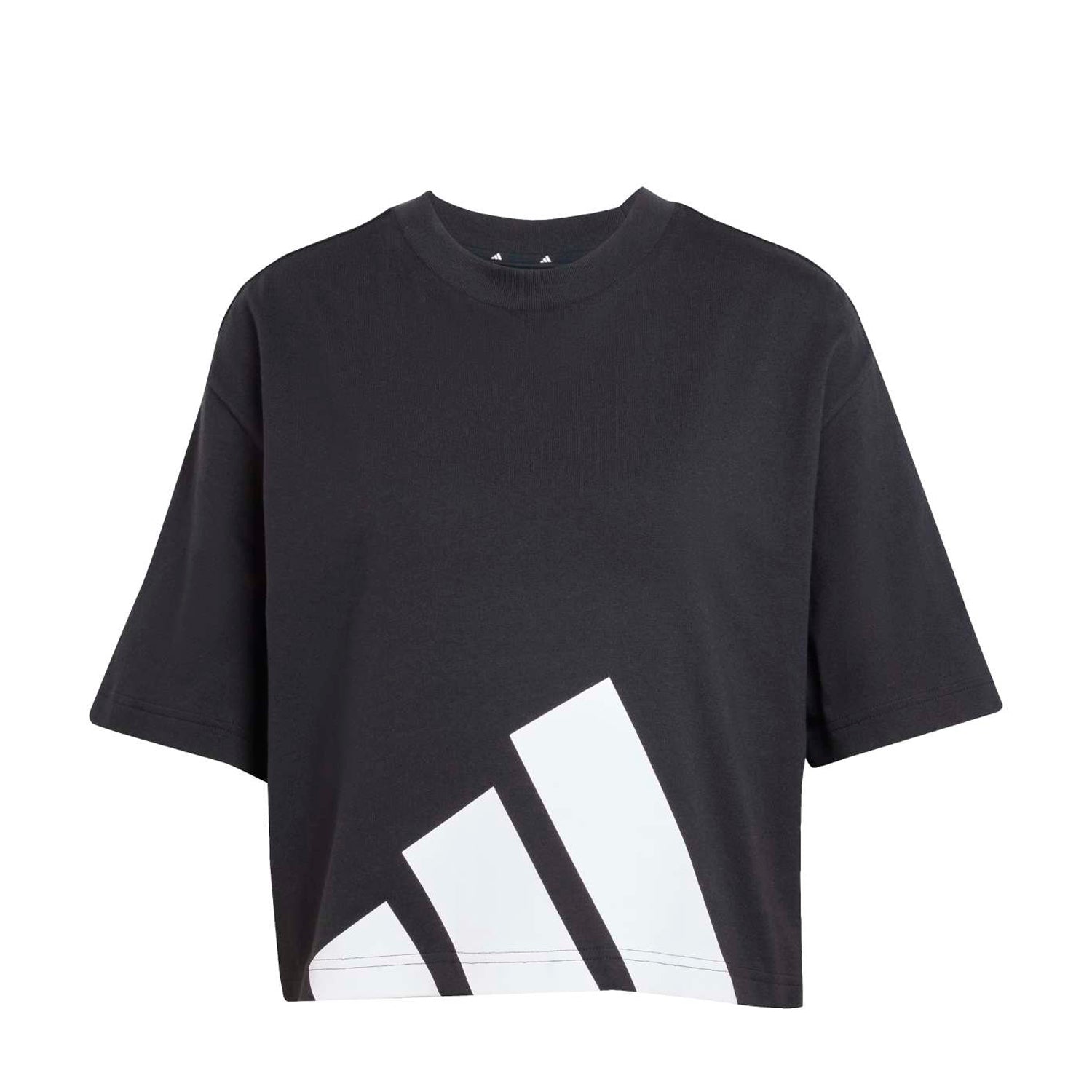 Front view of Fear of God Essentials oversized white tee with bold black chest logo, model wearing with denim