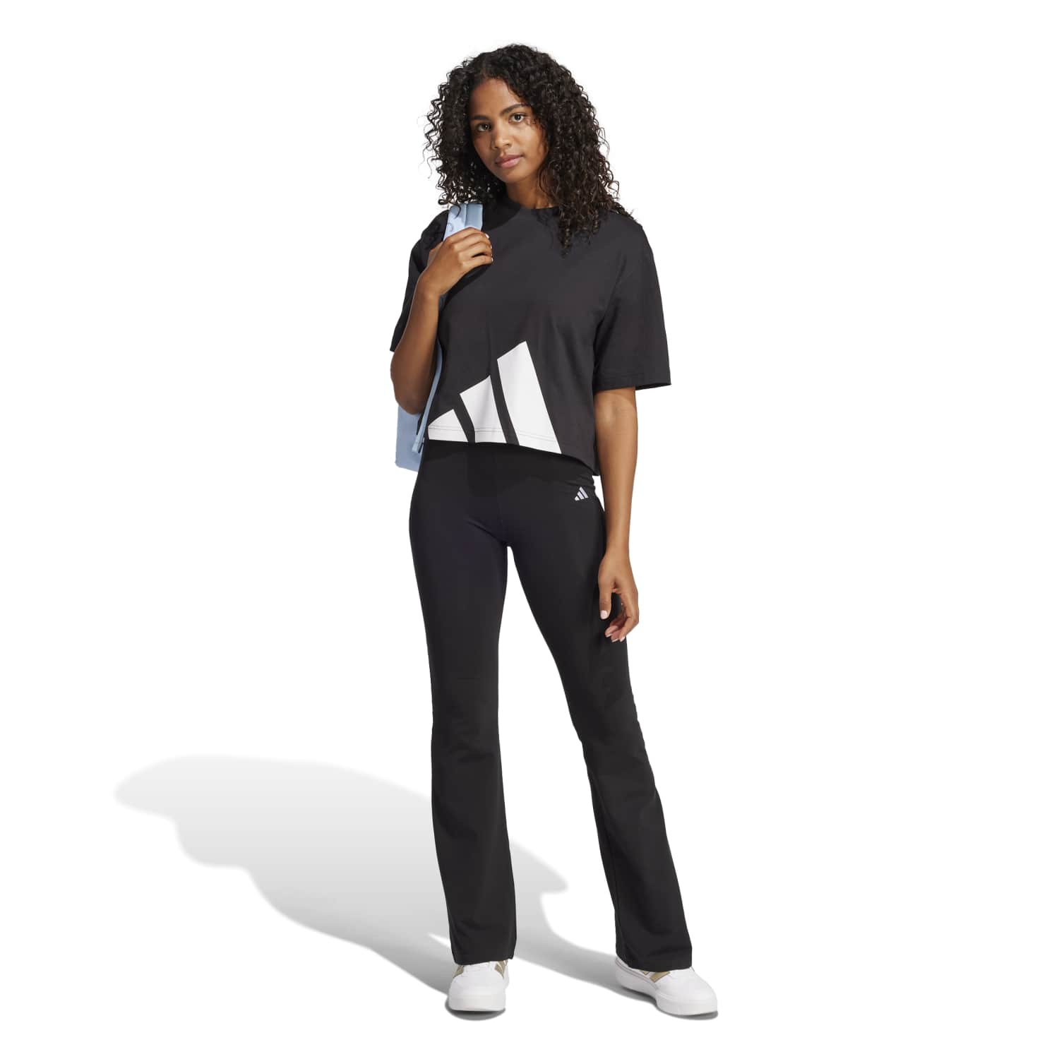 Side angle showing the tees longline drape and dropped shoulder seam