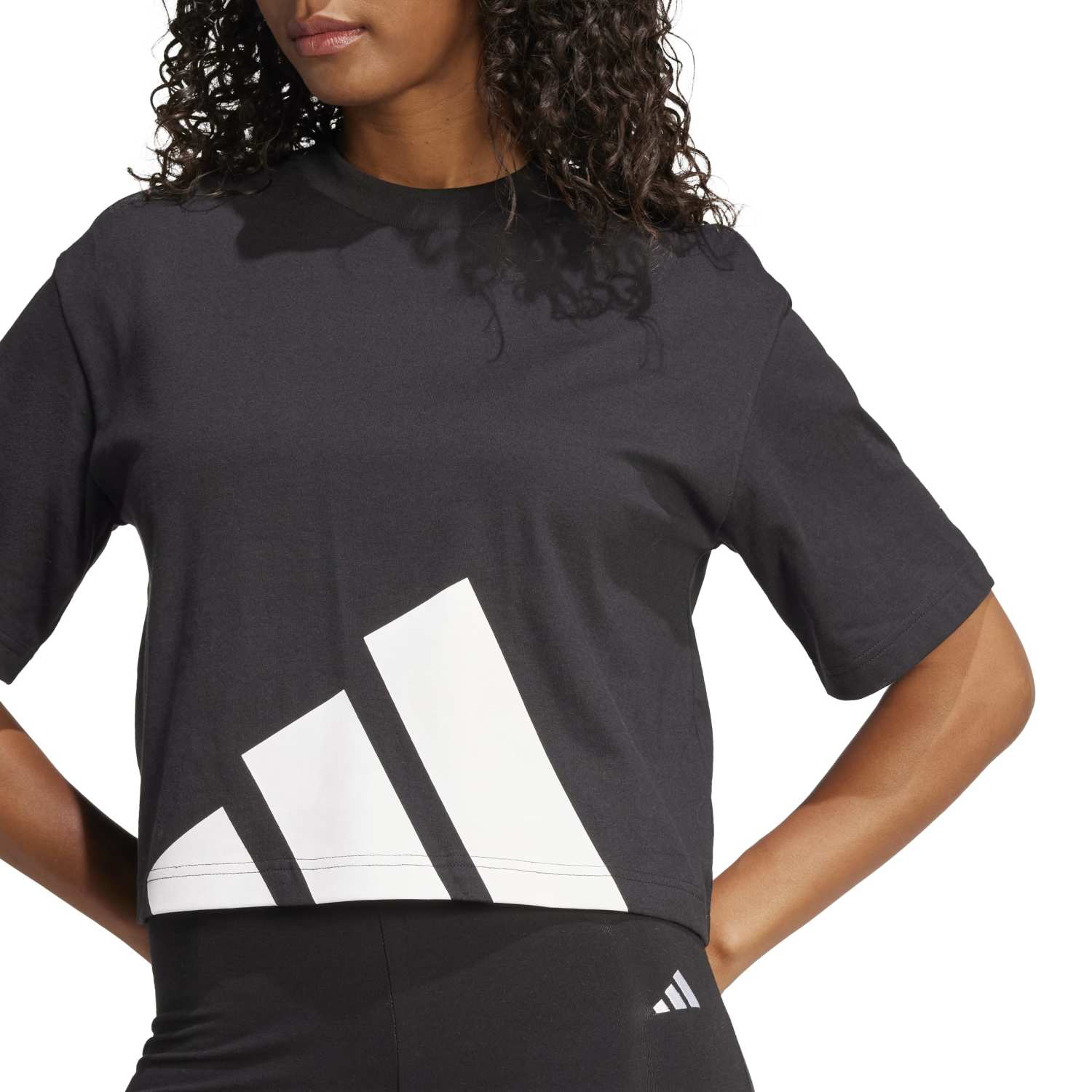 Side angle showing the tees longline drape and dropped shoulder seam