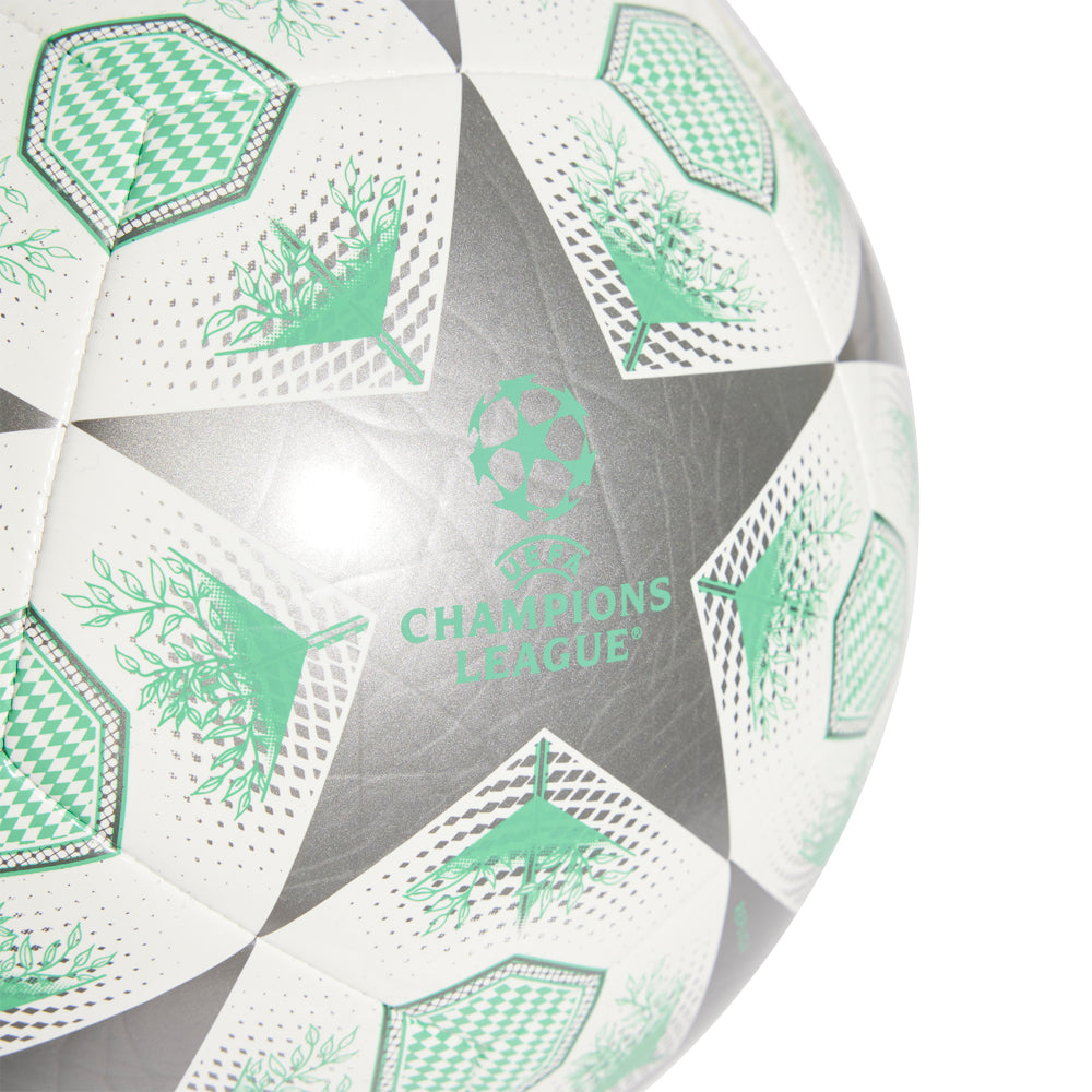 Player holding the Champions League 2025 ball in a stadium setting