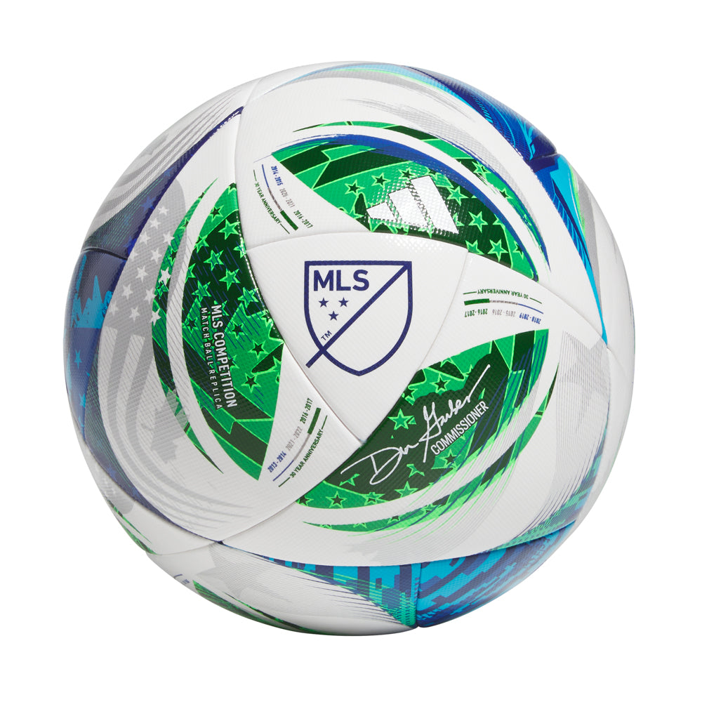 Player kicking the official MLS tournament soccer ball during a game, demonstrating durability and control