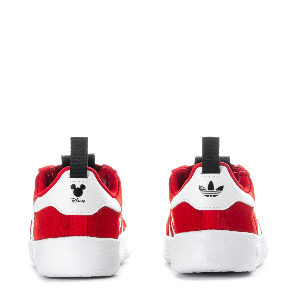 Toddler wearing AdiFom Superstar 360 Sneakers during outdoor play, highlighting their durability.