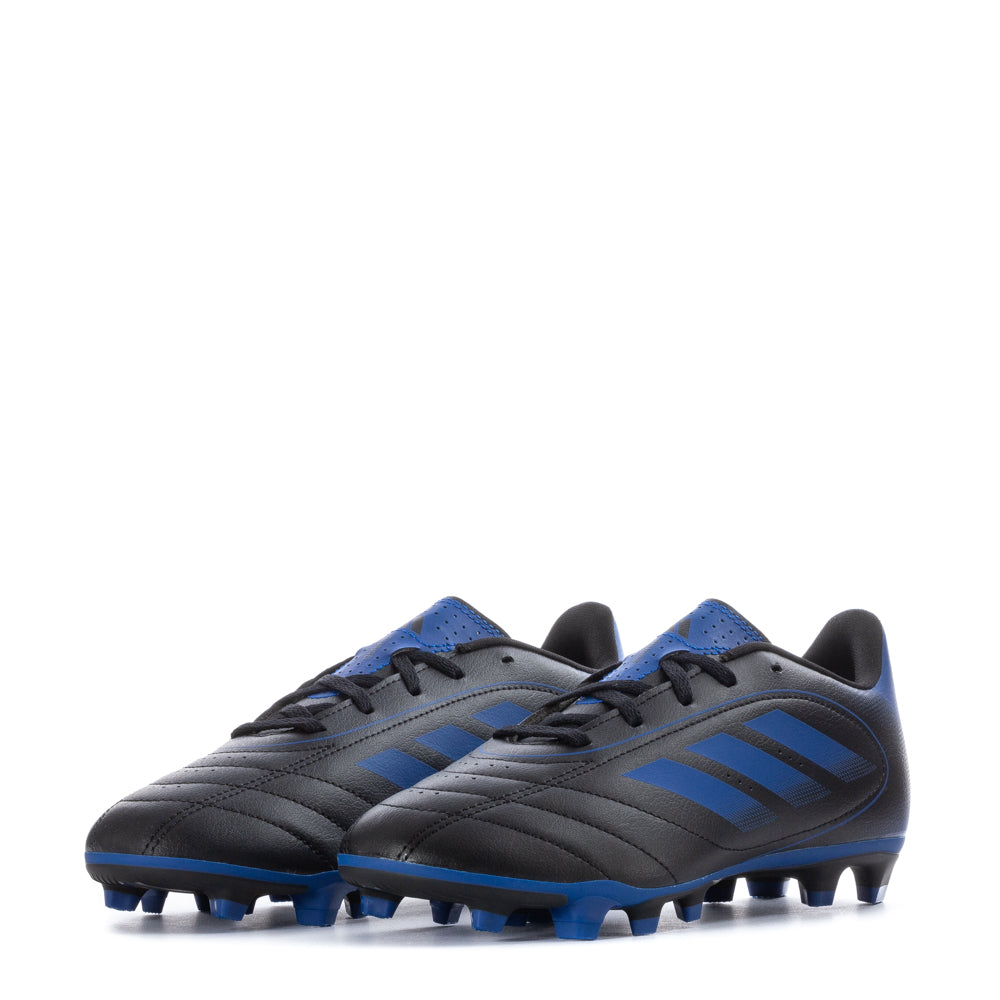 Close-up of the outsole of Adidas Goletto IX FG youth soccer cleats, highlighting the firm ground traction design.