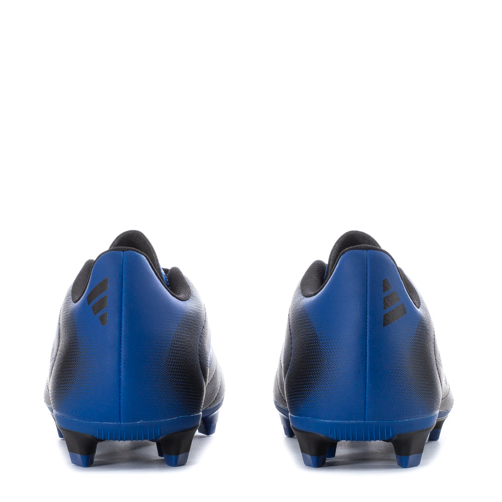 Action shot of kids wearing Adidas Goletto IX FG soccer cleats on artificial grass, demonstrating their versatility.