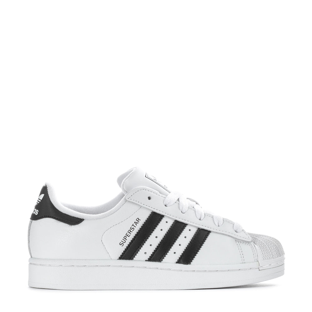 Adidas Superstar Women's Sneakers in black with rubber shell-toe and serrated 3-Stripes.